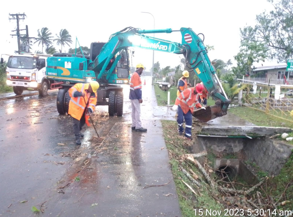 Authorities work to remove debris from roads and drains after Tropical Cyclone battered Fiji last night. Photo / Fiji National Disaster Management Office