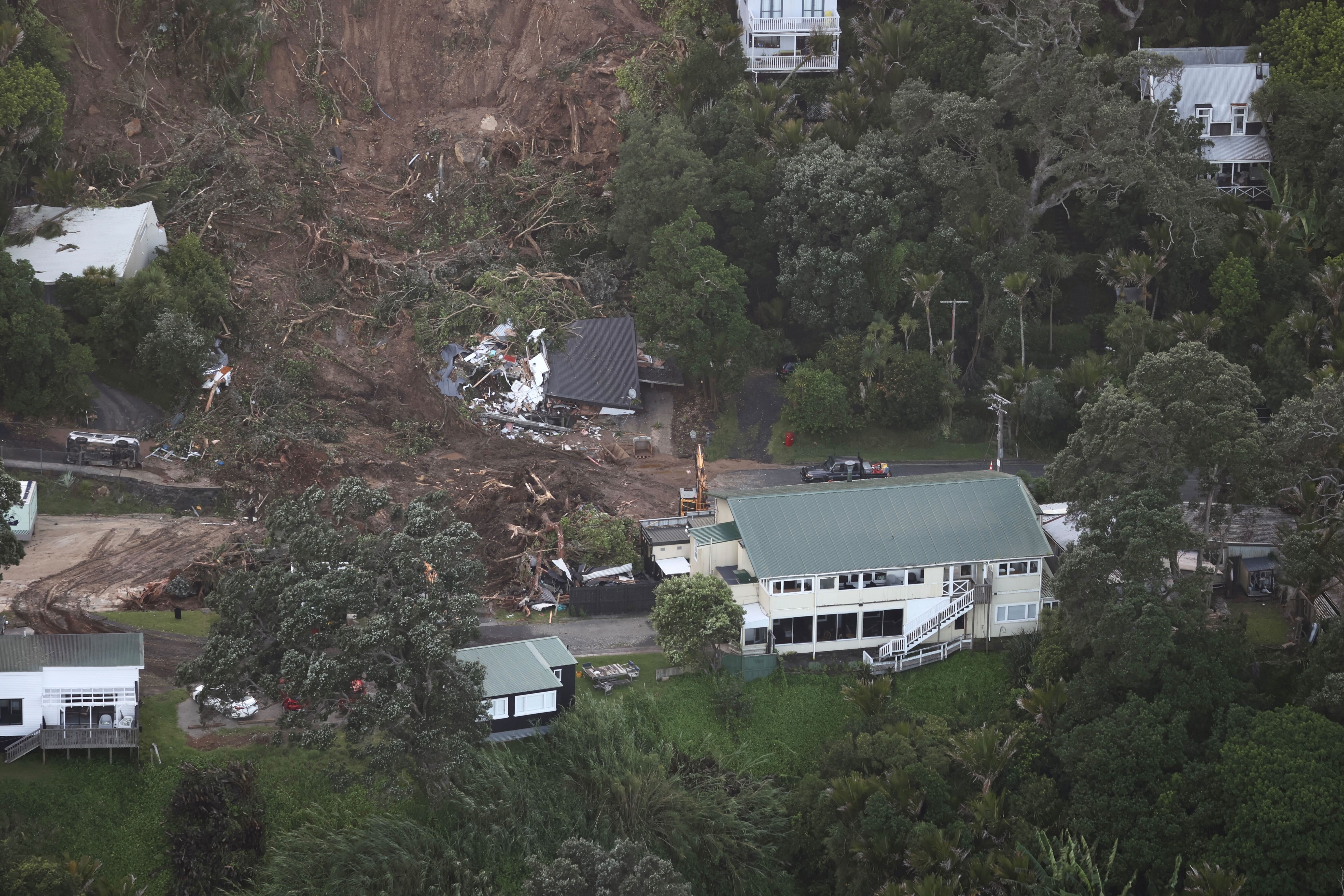 Aerial photographs show the extent of damage caused by a landslip at Muriwai. Photo / George Heard