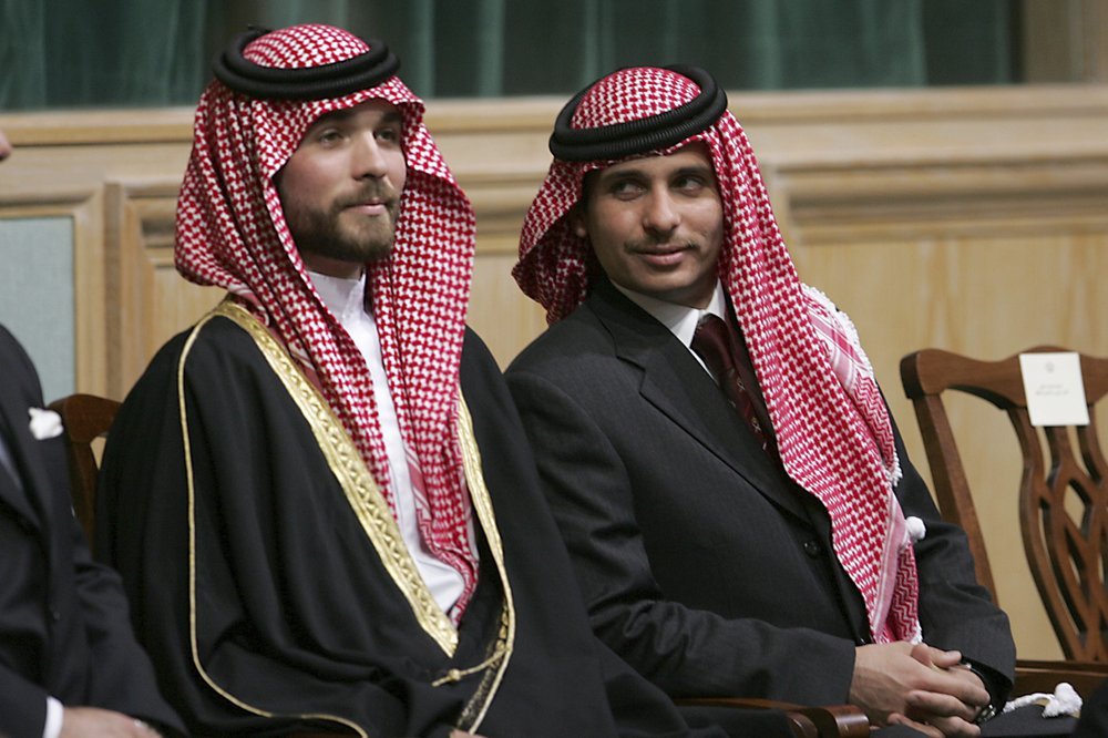 Prince Hamza Bin Al-Hussein, right, and Prince Hashem Bin Al-Hussein, left, brothers King Abdullah II of Jordan, attend the opening of the parliament in Amman, Jordan. Photo / AP