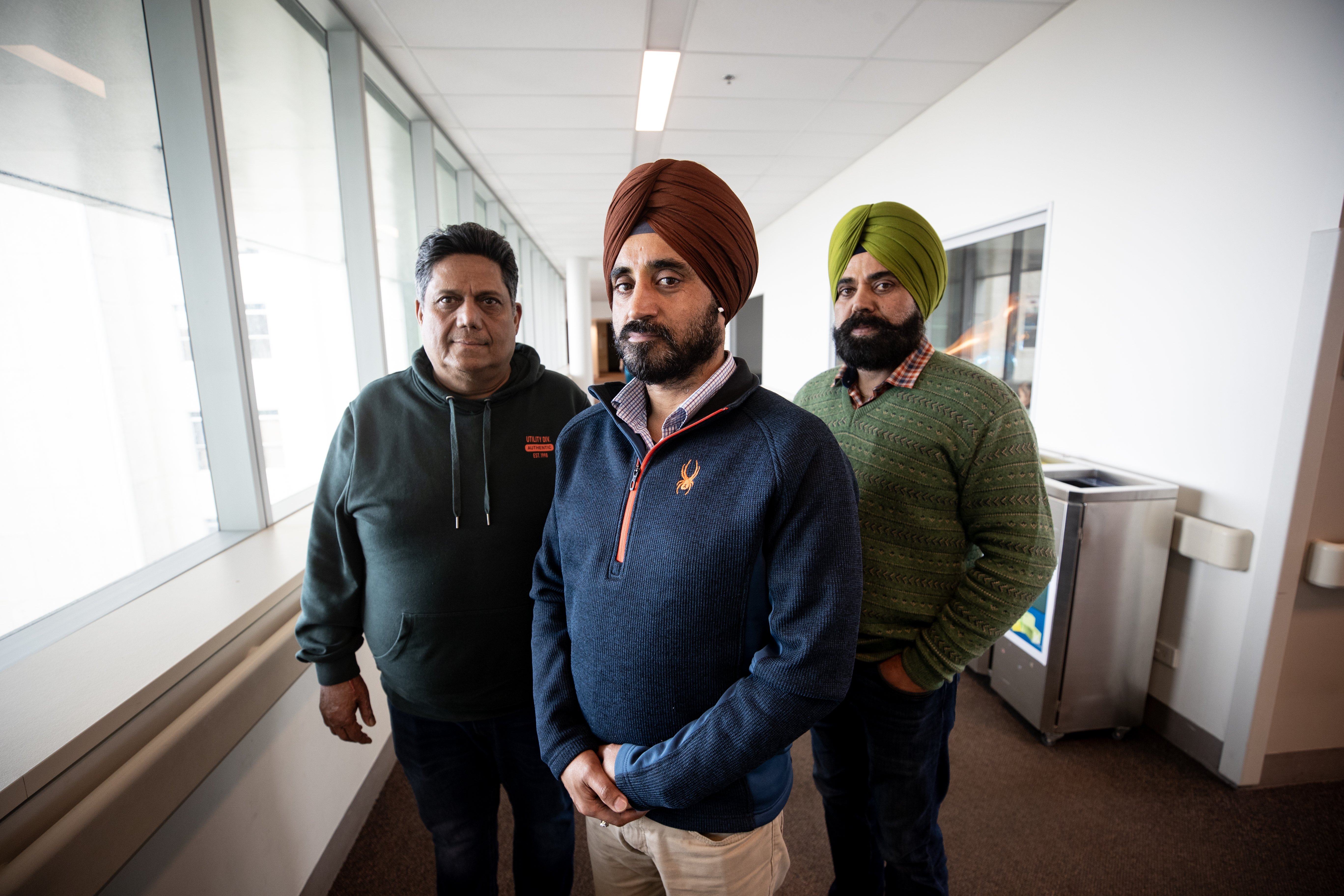 Local business leaders and family friends Rajesh Goel, Jag Sidhu and Karan Sidhu visiting Gurdeep Singh at the Auckland Hospital. Photo / Dean Purcell