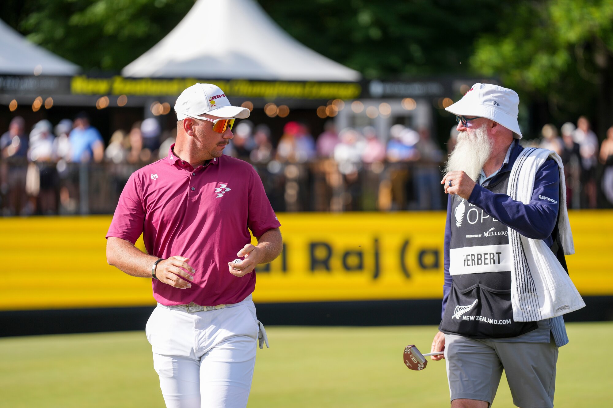 Lucas Herbert of Australia and his caddie Nick Pugh. Photo / Photosport