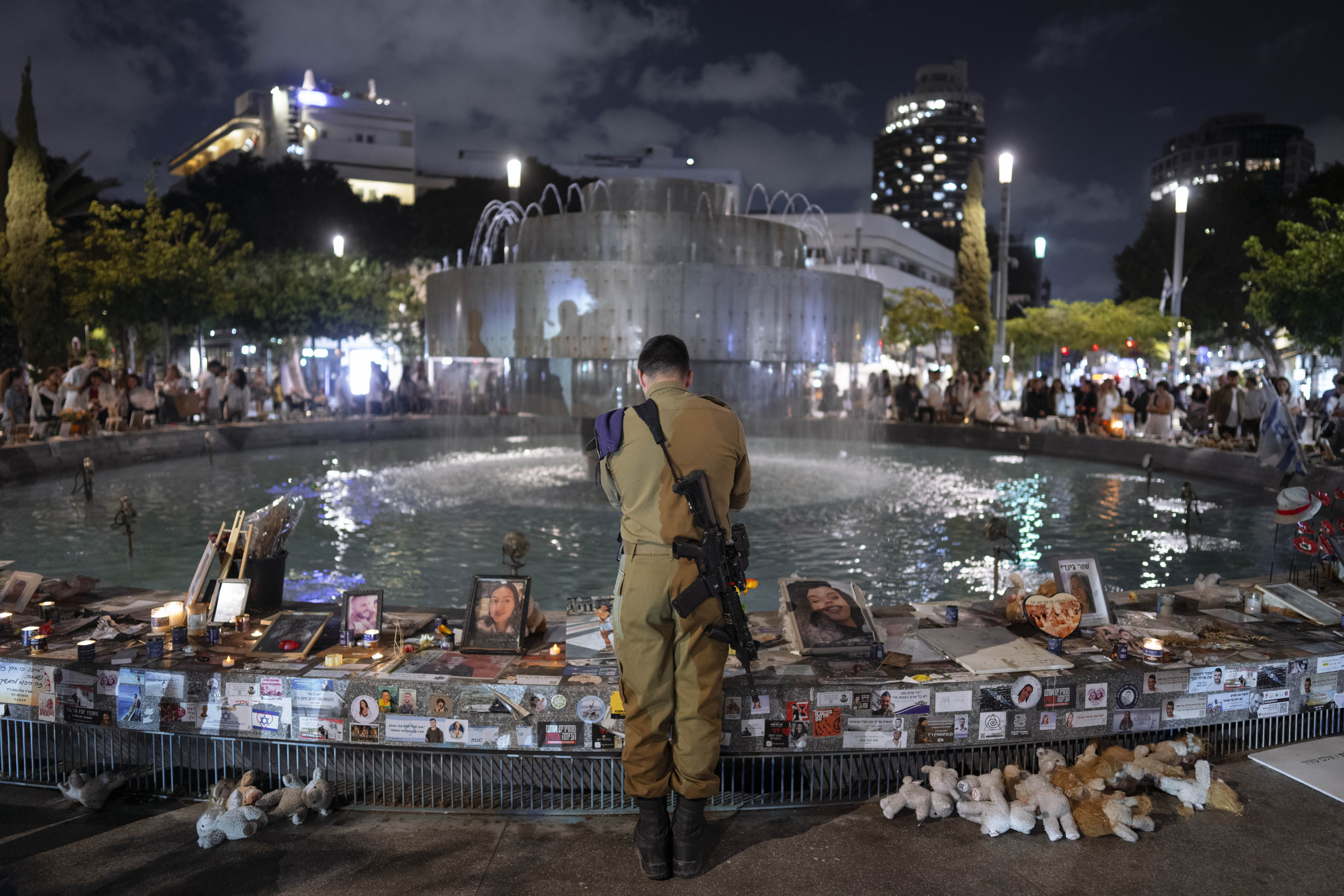 An Israeli soldier pays respect at a memorial for victims of the bloody October 7 cross-border attack by Hamas militants on the eve of Israel's annual Memorial Day for fallen soldiers and victims of nationalistic attacks. Photo / AP