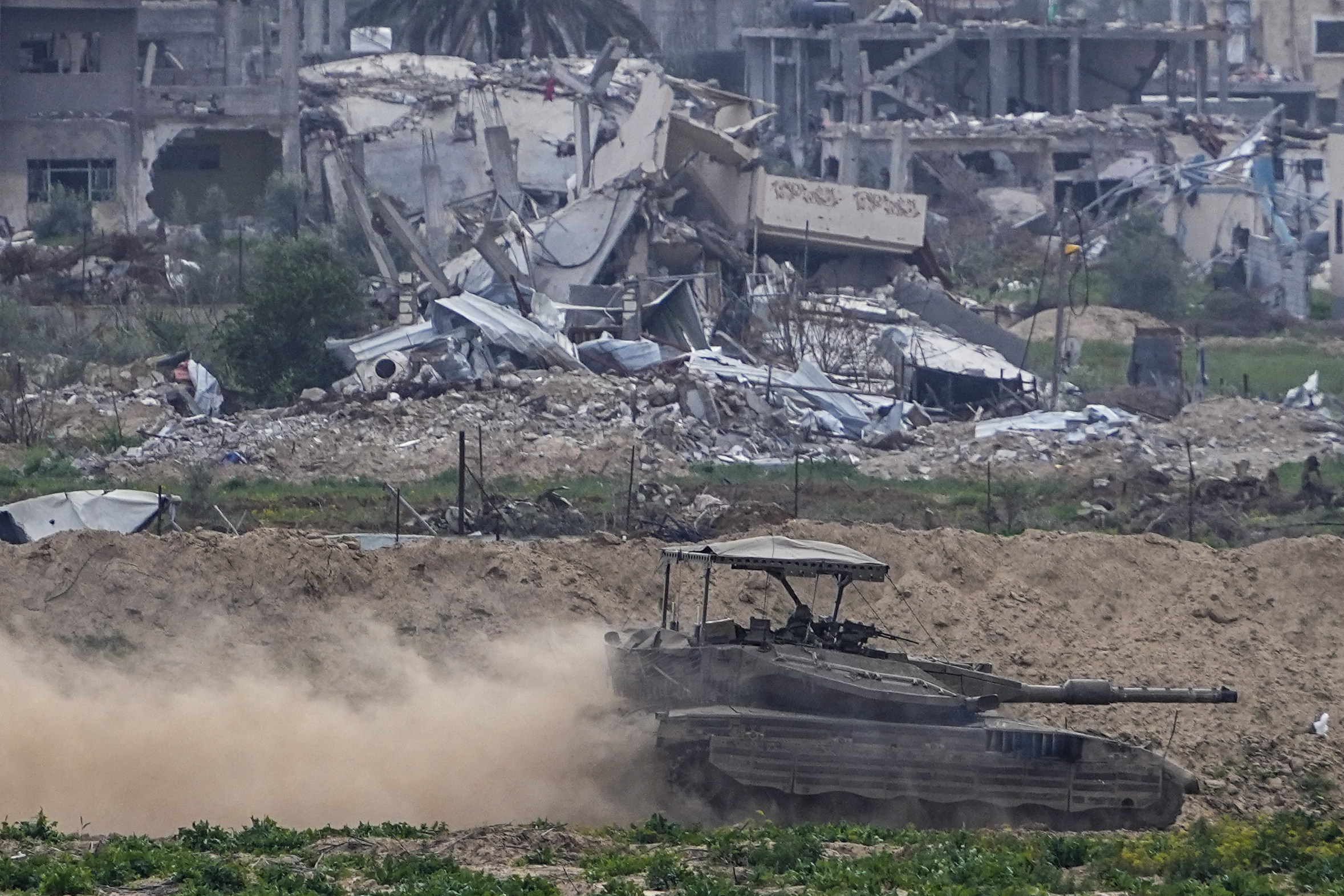 An Israeli tank on patrol in the Gaza Strip, as seen from southern Israel. Photo / AP