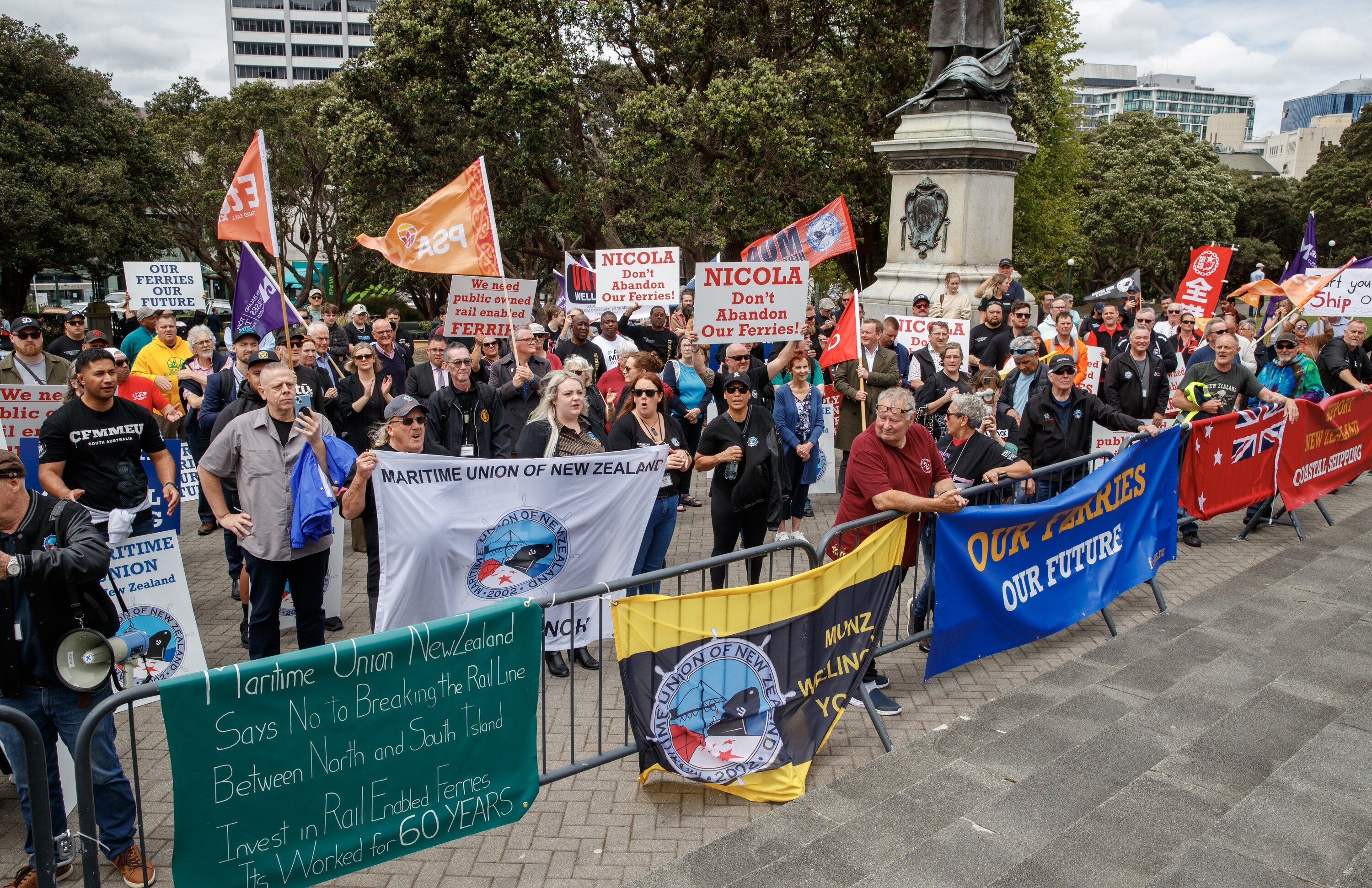 At least 100 people joined the rally calling on the Government to invest in publicly owned and operated rail-capable ferries. Photo / Mark Mitchell