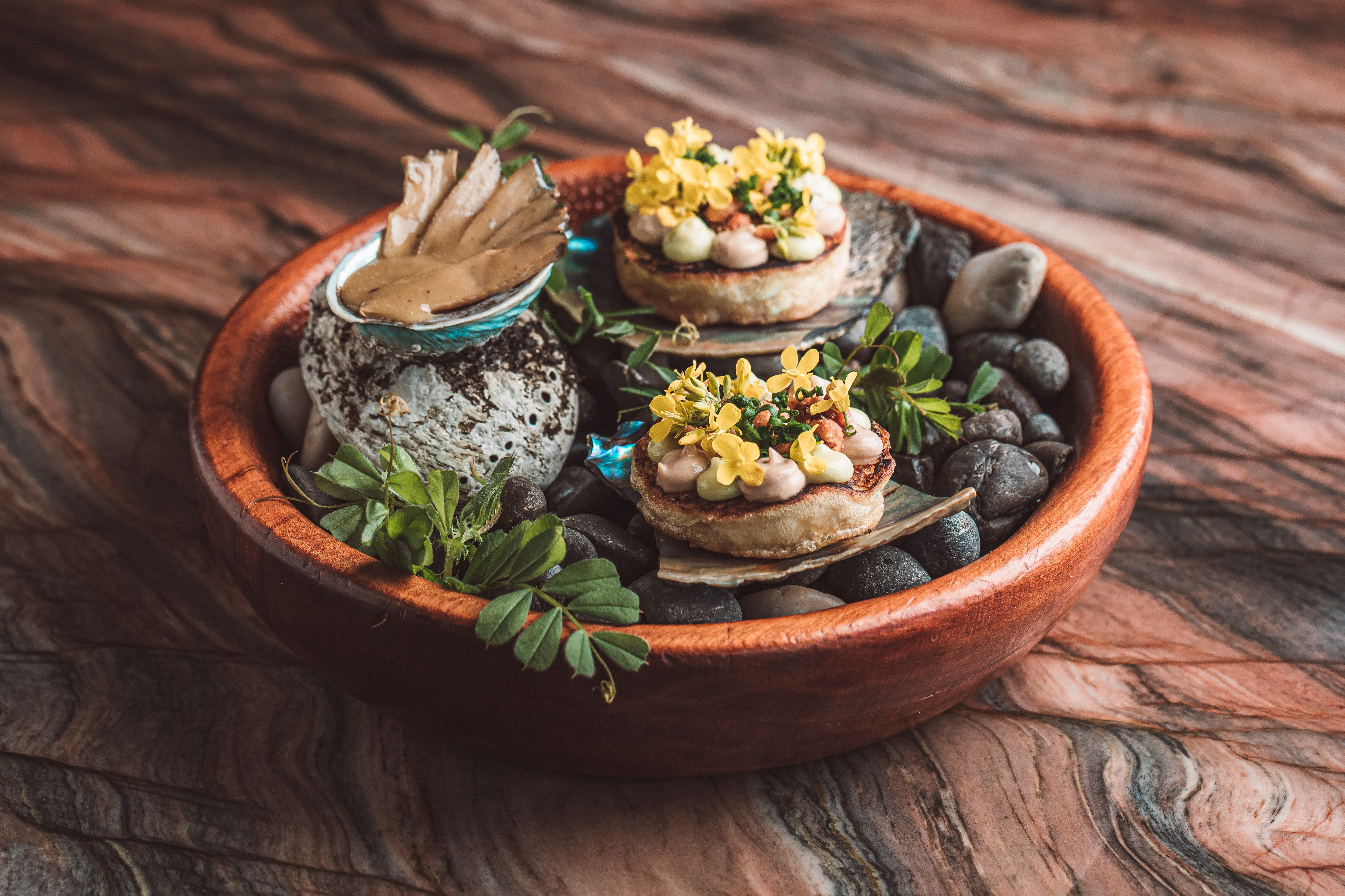 Ahi's Queen pāua crumpet with fermented peanut butter, smoked dulse and celery leaf mayonnaise. Photo / Tez Mercer