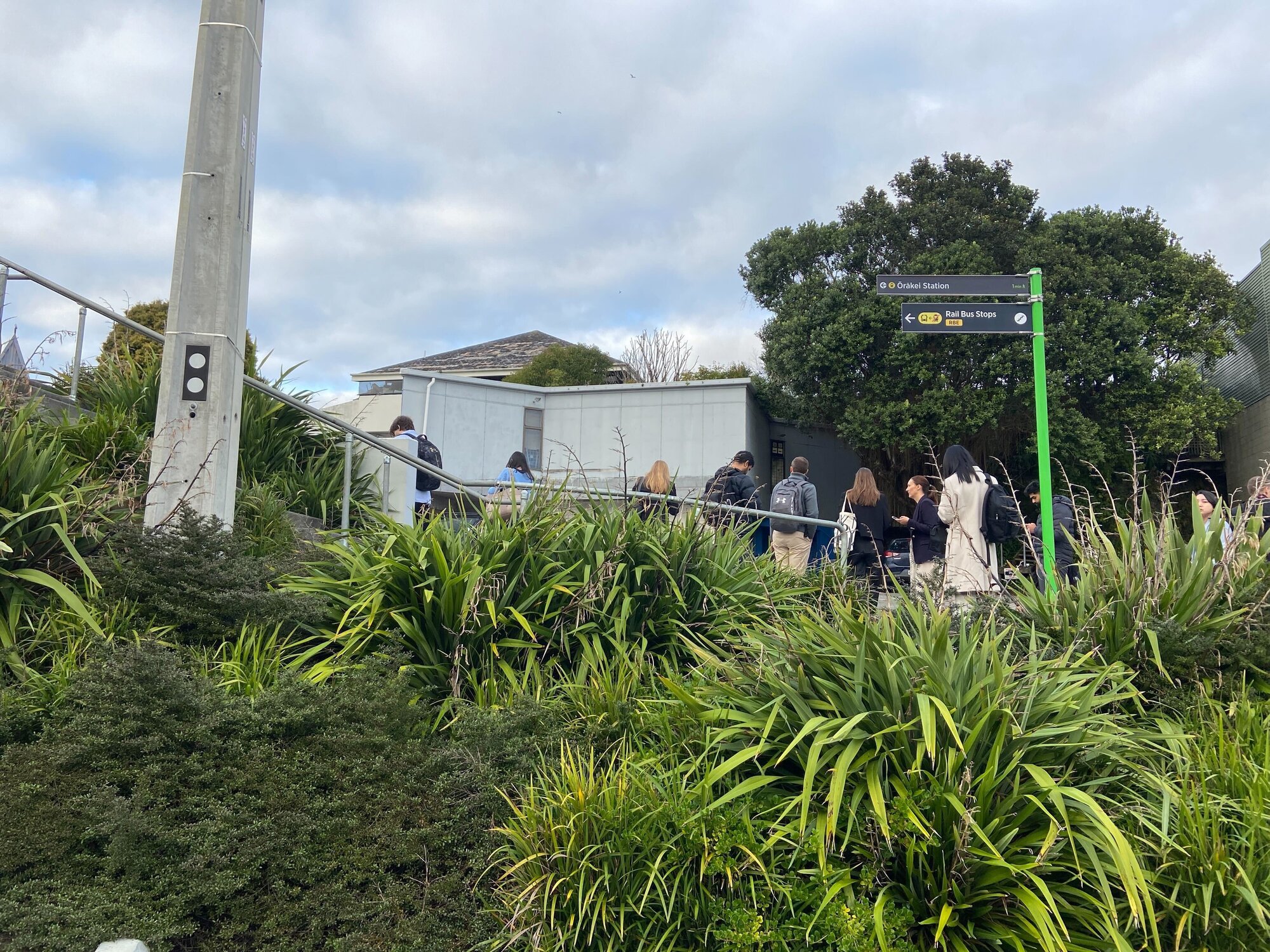 Passengers waiting for alternative transport after offloading at Ōrākei Station. Photo / NZ Herald