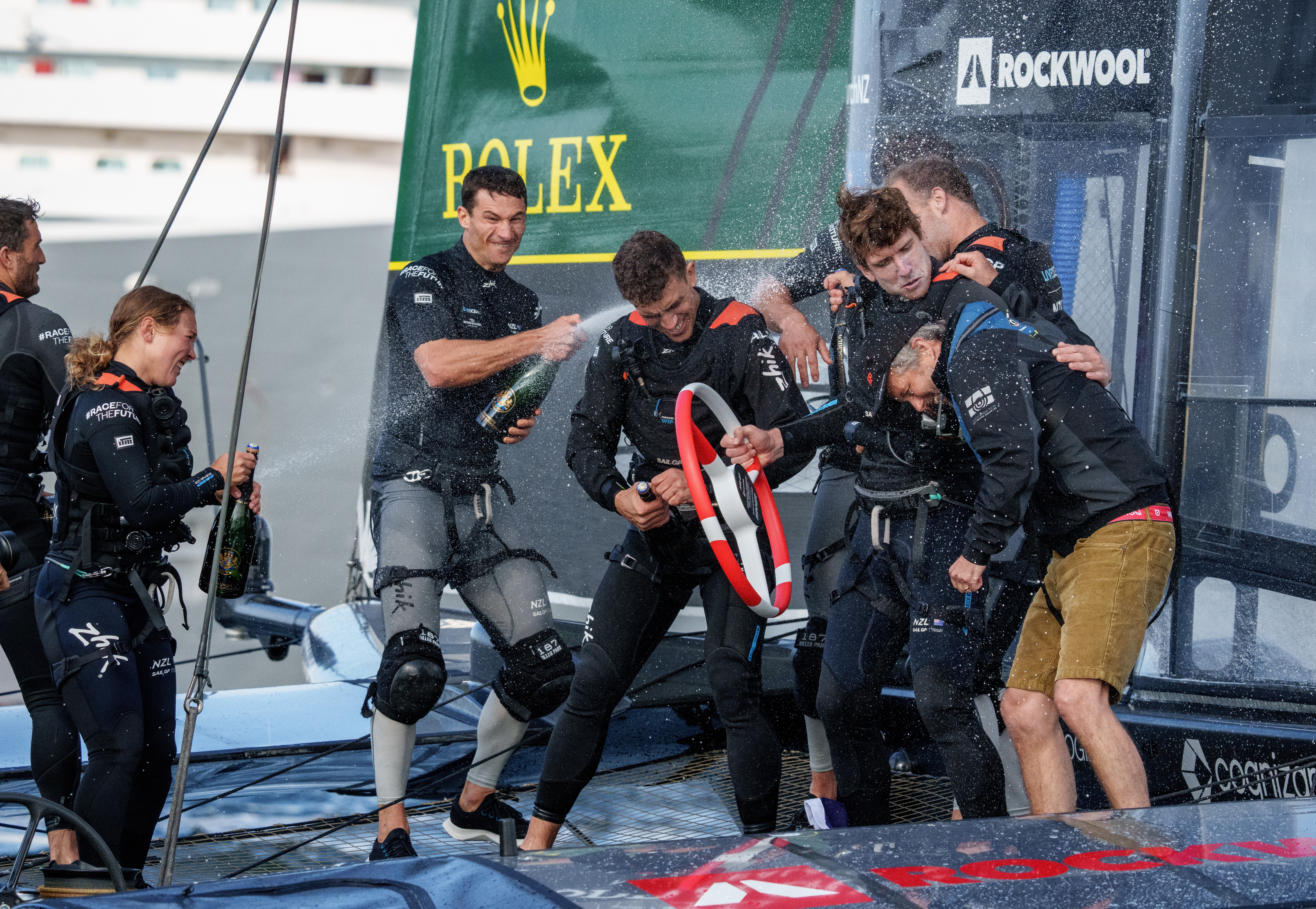 Andy Maloney (centre) celebrates with the Black Foils after their win at the Denmark SailGP event in 2022. Photo / Bob Martin, SailGP