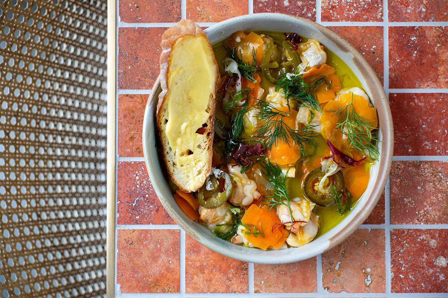 Clam escabeche with white wine and sea herb salad. Photo / Babiche Martens