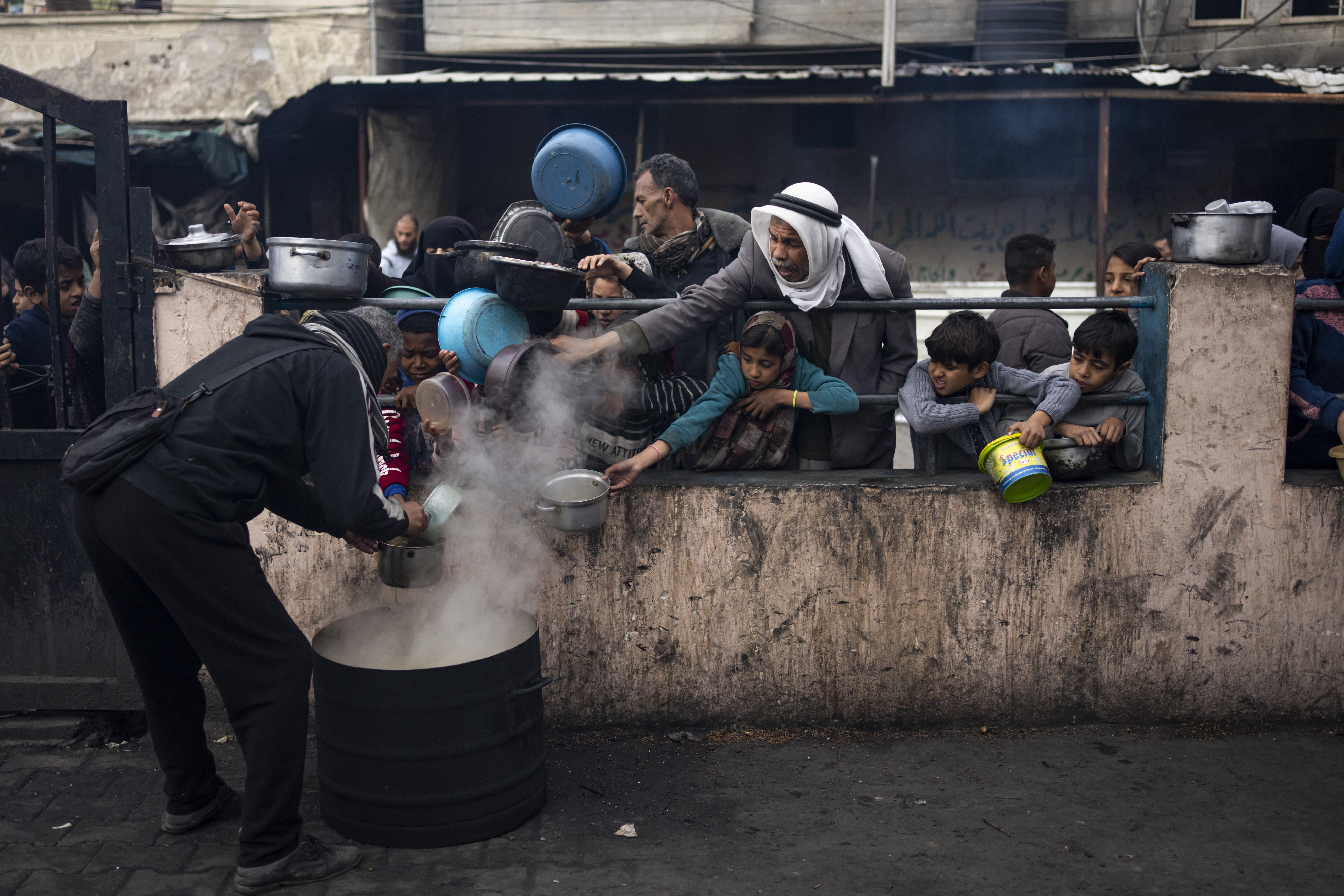 Palestinians line up for a meal in Rafah, Gaza Strip. Photo / AP