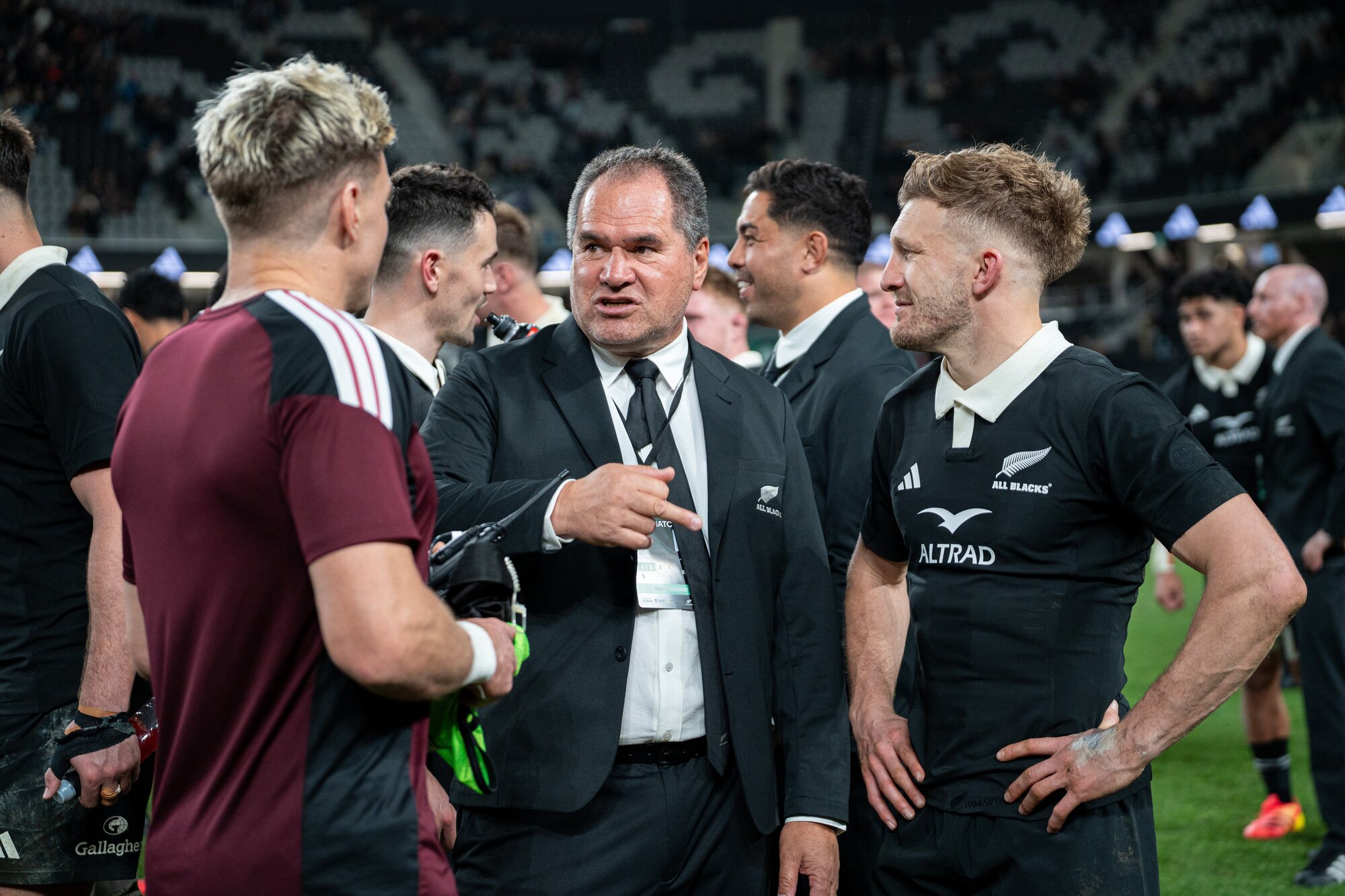 Dave Rennie (centre) speaks with Beauden Barrett (left) and Damian McKenzie after the win over France. Photo / Alyse Wright