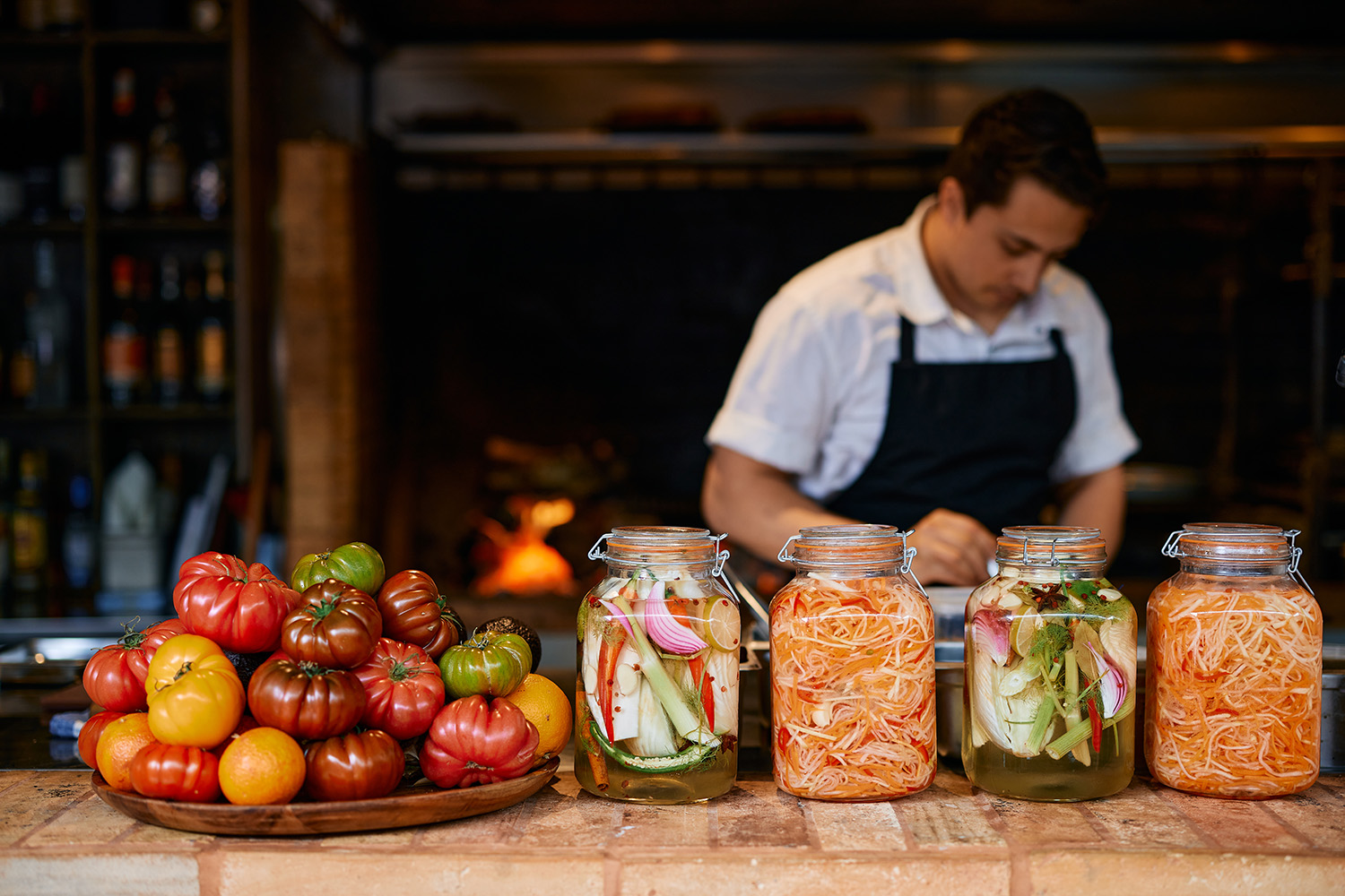 Pickling vegetables and fresh produce embellish the open-air restaurant. Photo / Babiche Martens