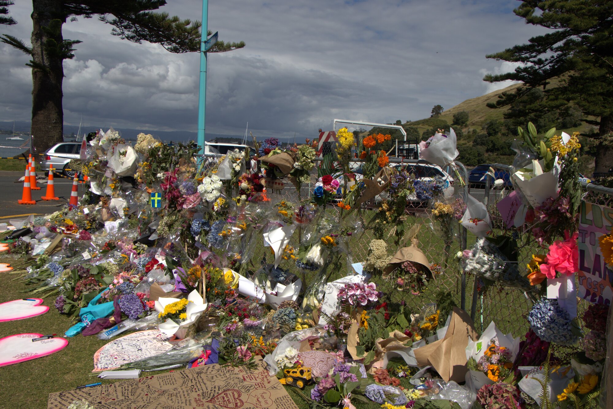 Bouquets and tributes at the Mount Maunganui landslide cordon. Photo / Ayla Yeoman