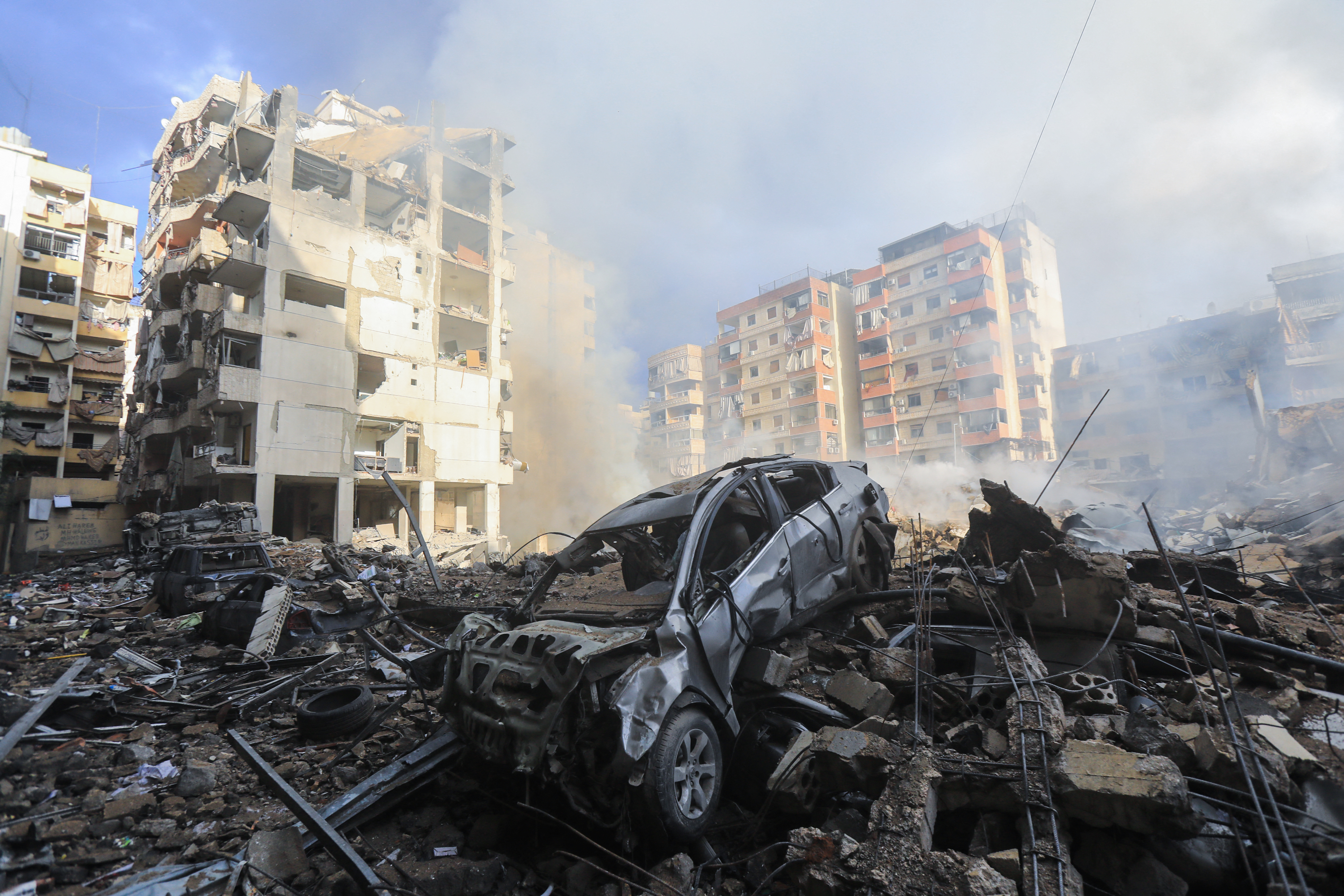 Smoke seeps out from building rubble at the site of an overnight Israeli airstrike on the Laylaki neighbourhood in Beirut's southern suburbs on October 1. Photo / AFP