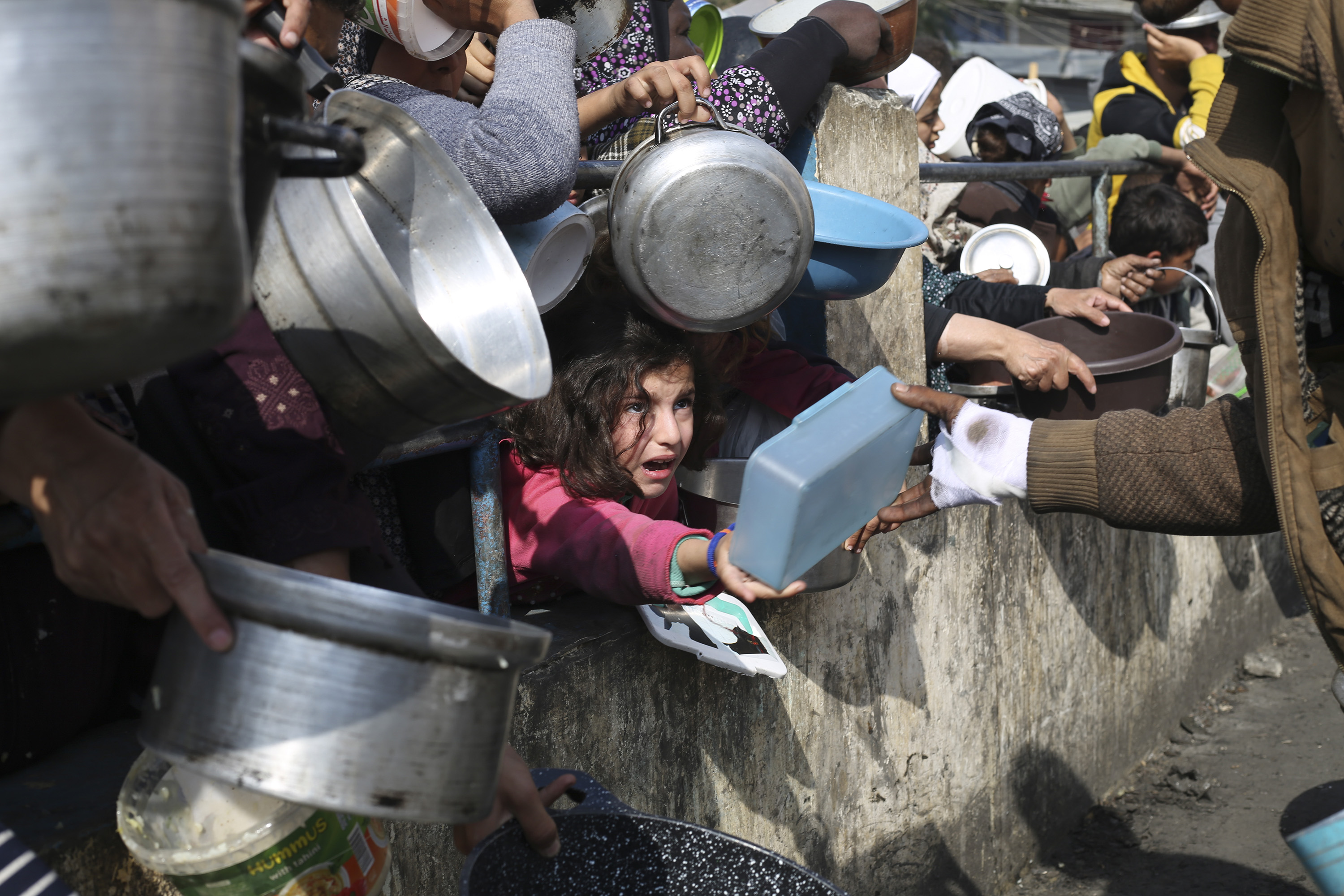 Palestinians line up for free food during the ongoing Israeli air and ground offensive on the Gaza Strip in Rafah. Photo / AP