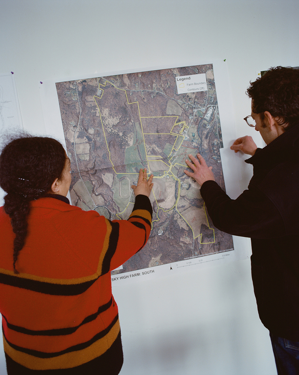 Sarah Workneh and Josh Bardfield study the new property at Sky High Farm. Photo / Alex Hodor-Lee, The New York Times
