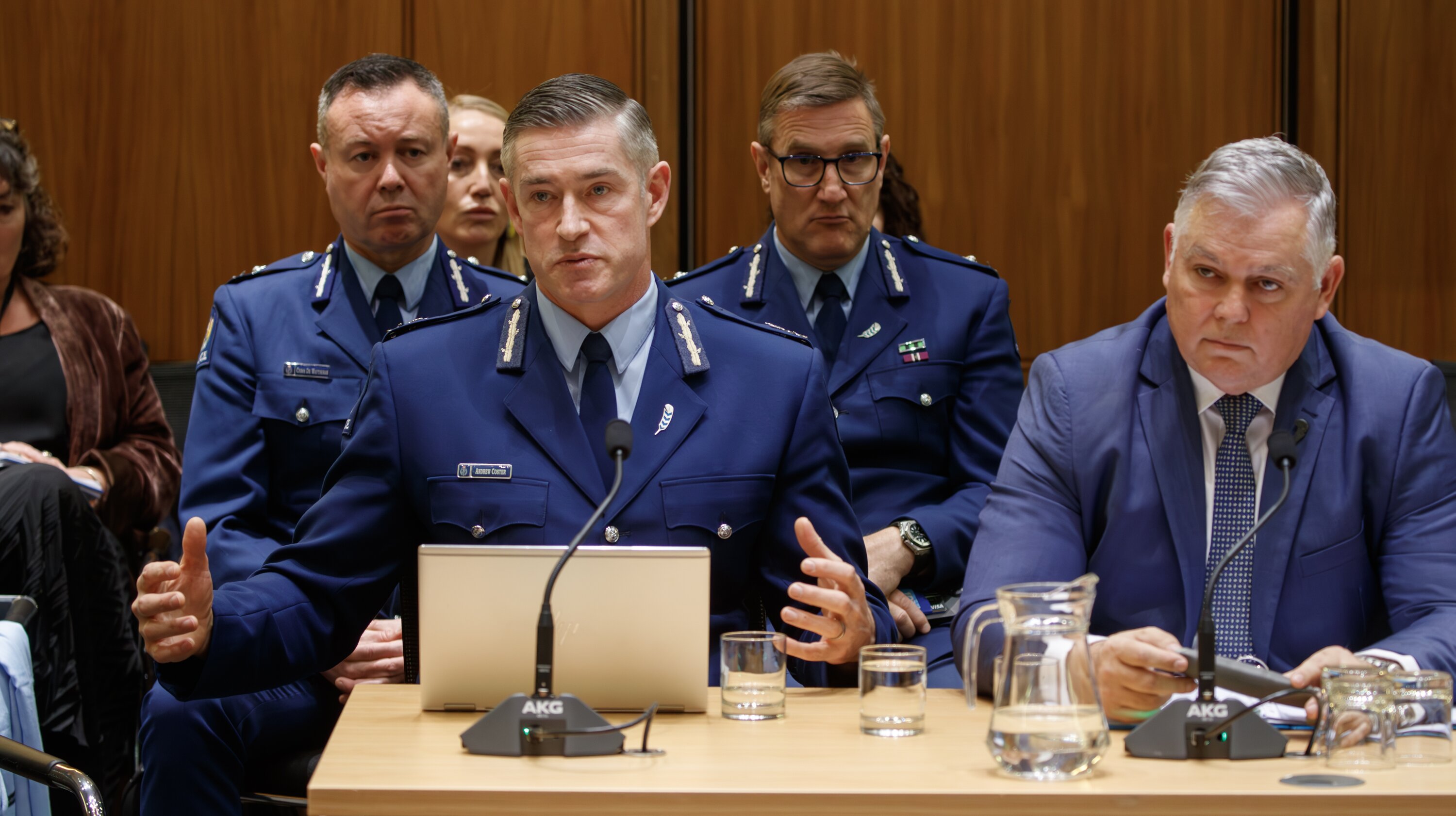 Former Police Commissioner Andrew Coster (front left) and Police Minister Mark Mitchell (front right), with Jevon McSkimming seated behind and between them, at a justice select committee hearing in 2024. Photo / Mark Mitchell