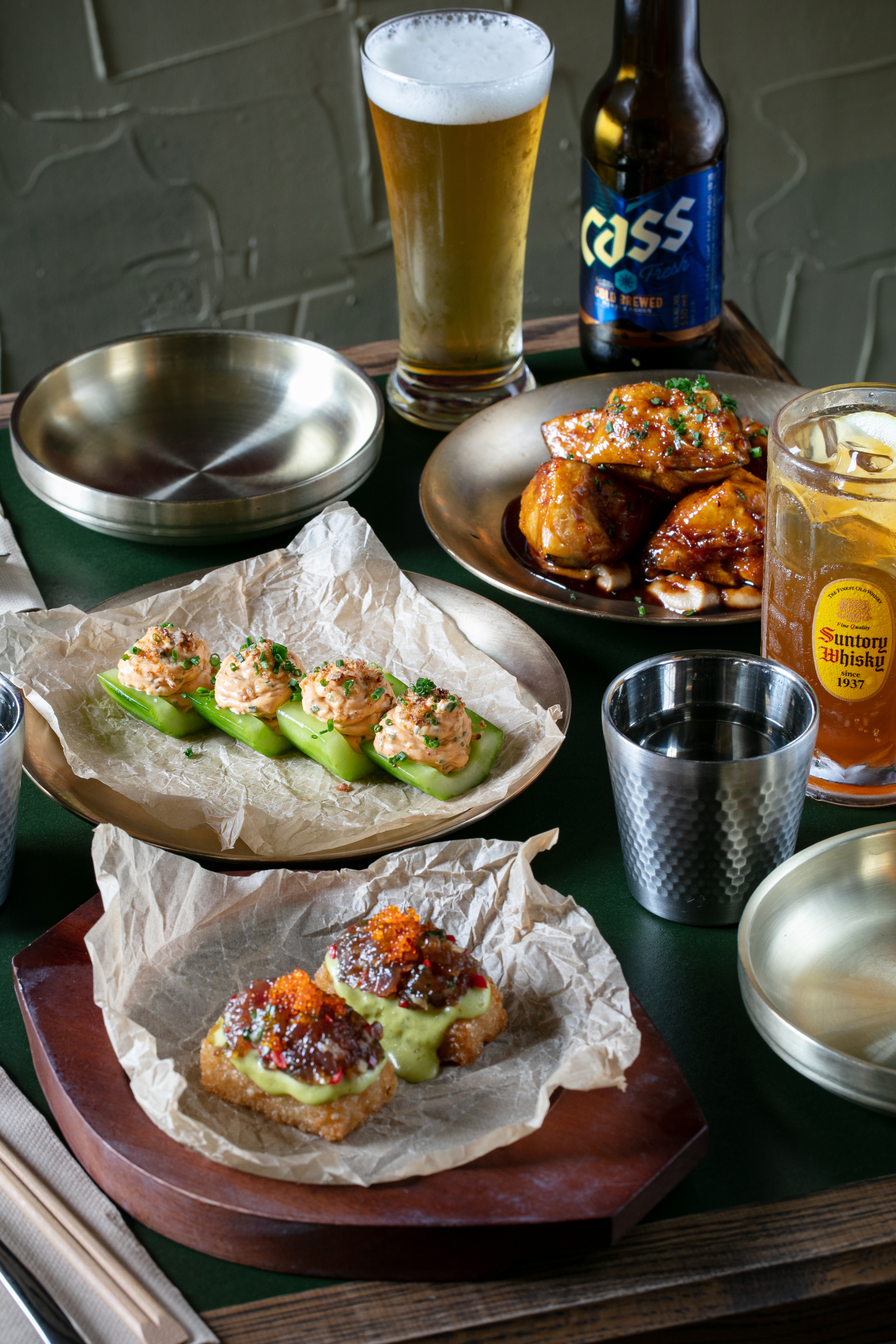 The crispy rice with spicy tuna tartare, cucumber with kimchi mascarpone, and crispy eggplant on the menu at Aigo. Photo / Babiche Martens