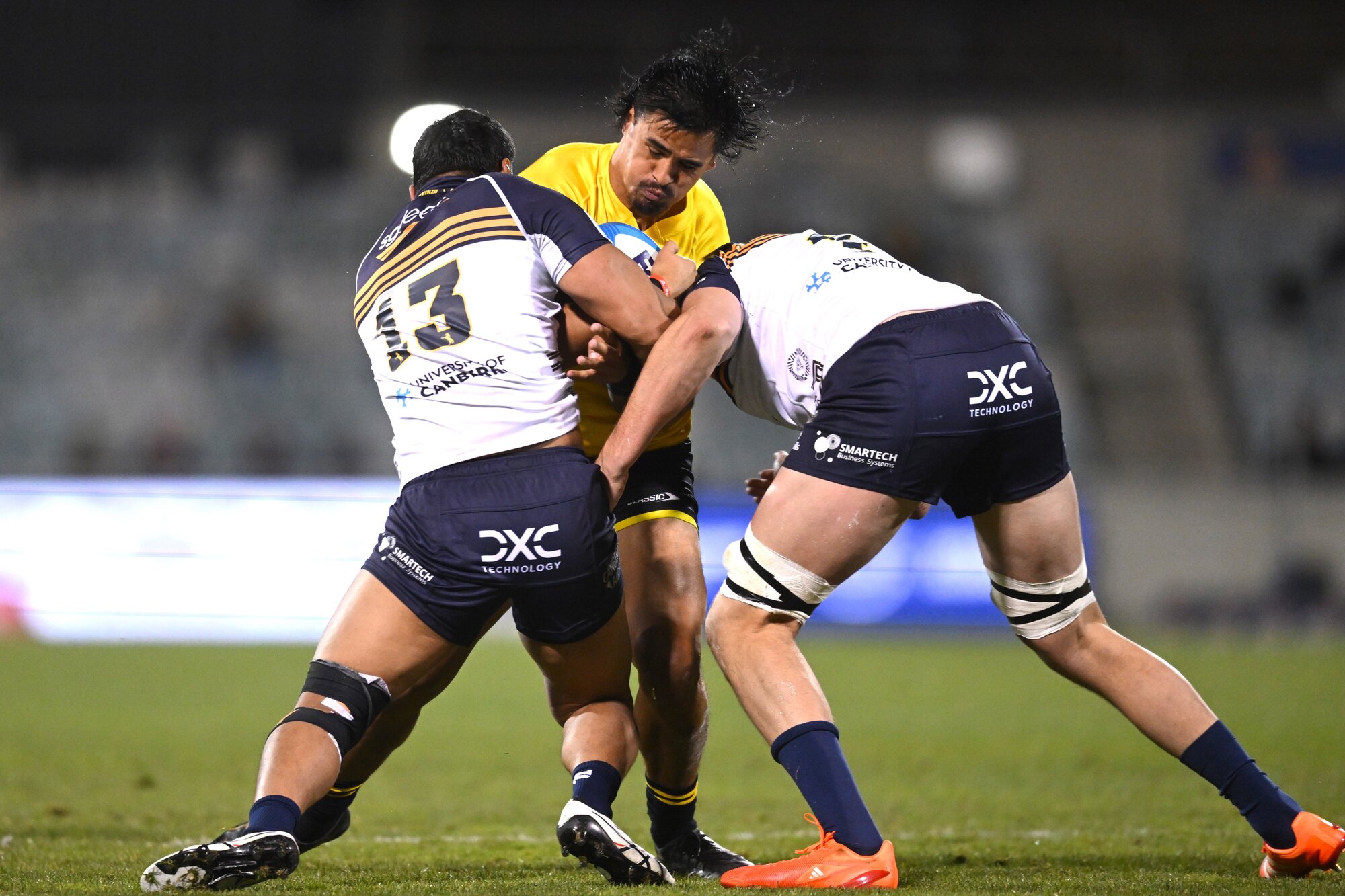 Hurricanes wing Bailyn Sullivan takes the ball into contact against the Brumbies. Photo / Photosport