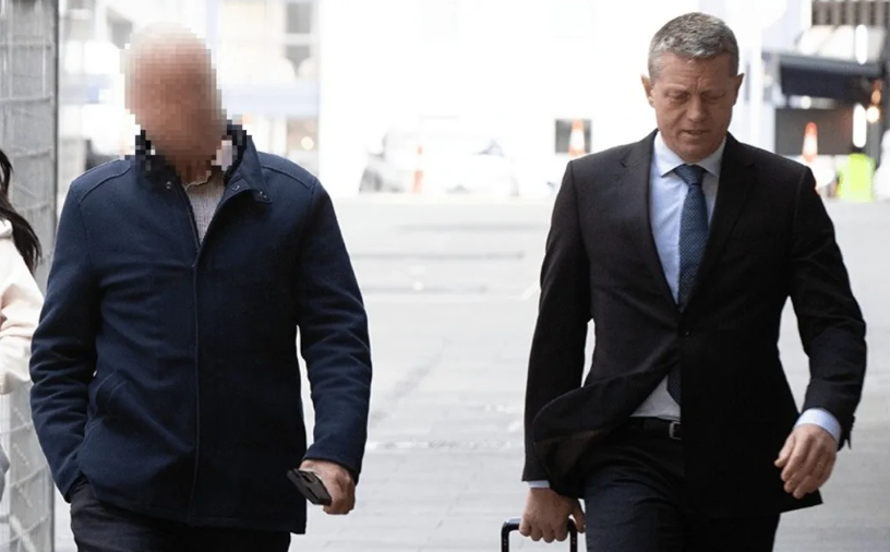 The former political figure heading into court with his lawyer Ian Brookie. Photo / RNZ/Calvin Samuel