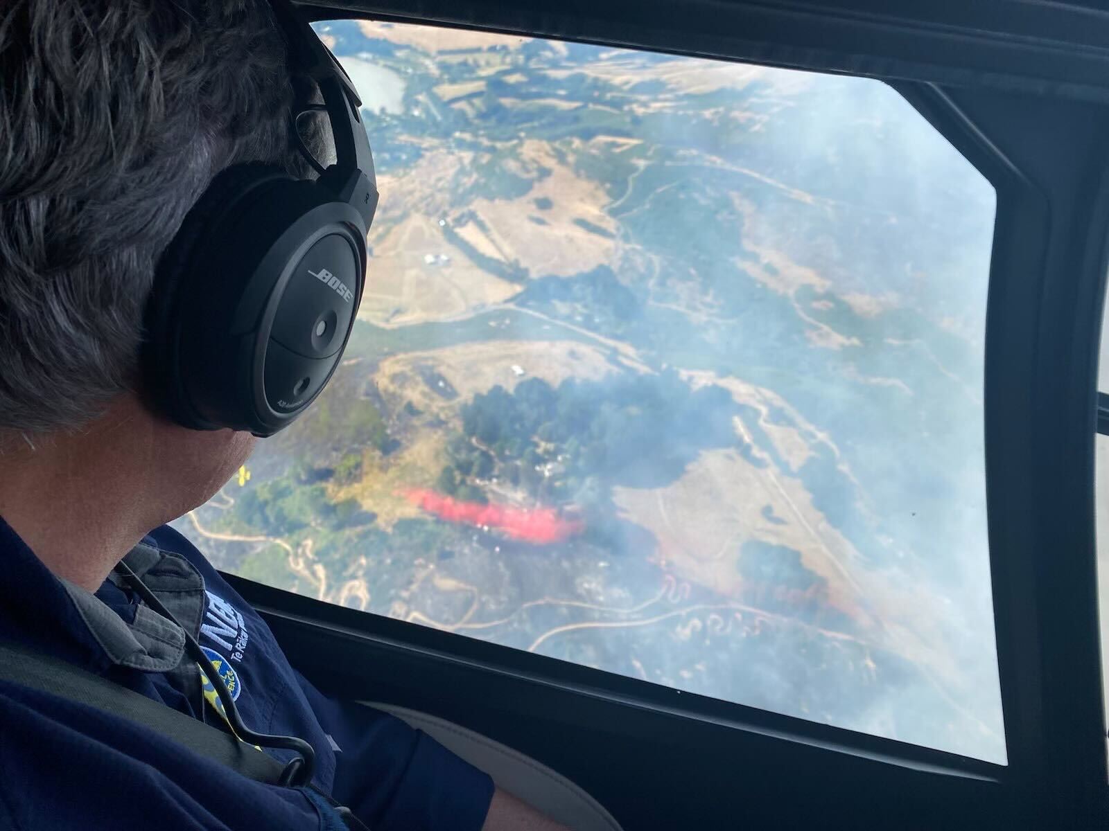 Civil Defence Minister Mark Mitchell surveying the fire field. Photo / Supplied