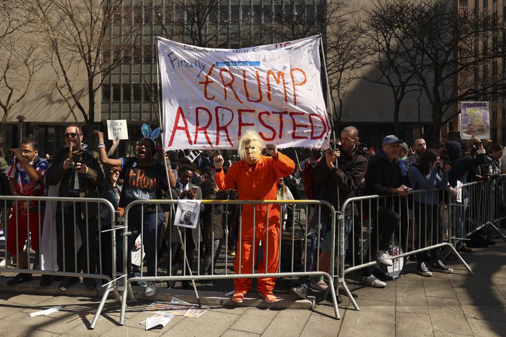 Demonstrators gather outside the New York City Criminal Court. Photo / AP