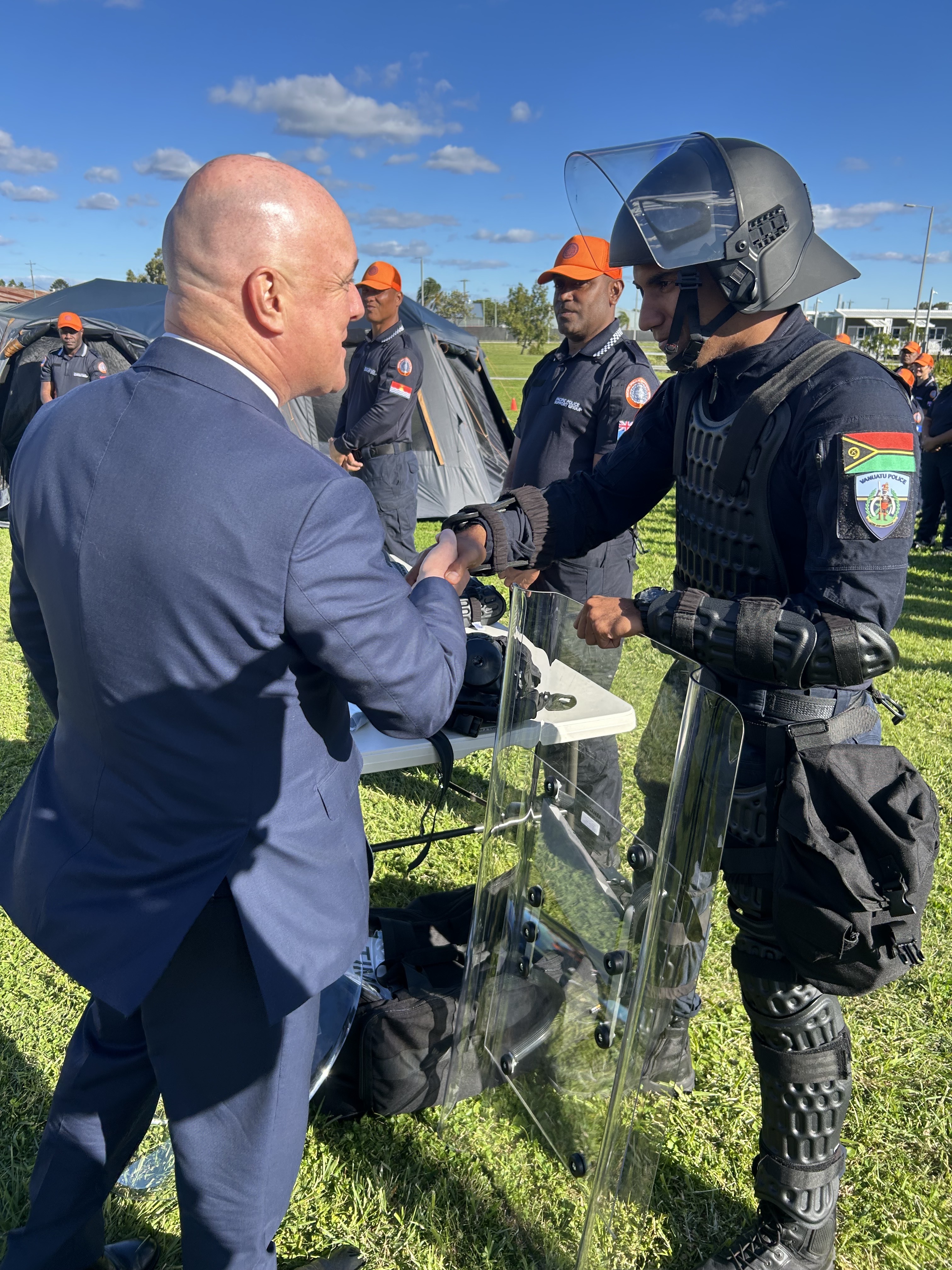 Prime Minister Christopher Luxon meets with a Pacific Policing unit member at a base in Brisbane. Photo / Adam Pearse