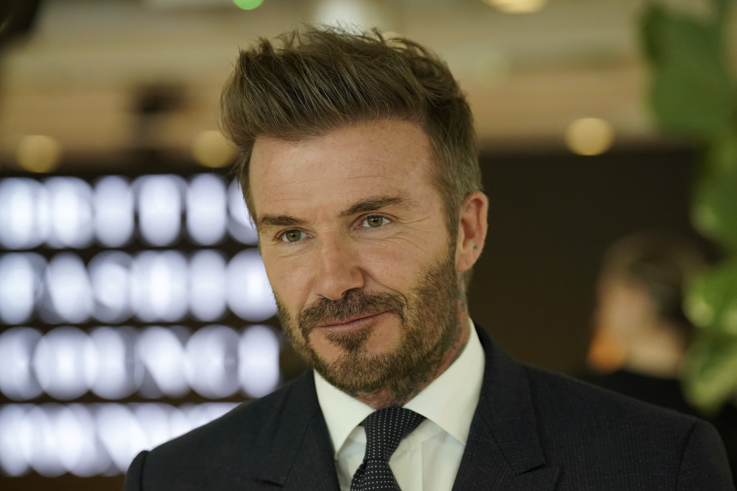 David Beckham's alleged mistress has claimed she found him in bed with another woman. Photo / AP