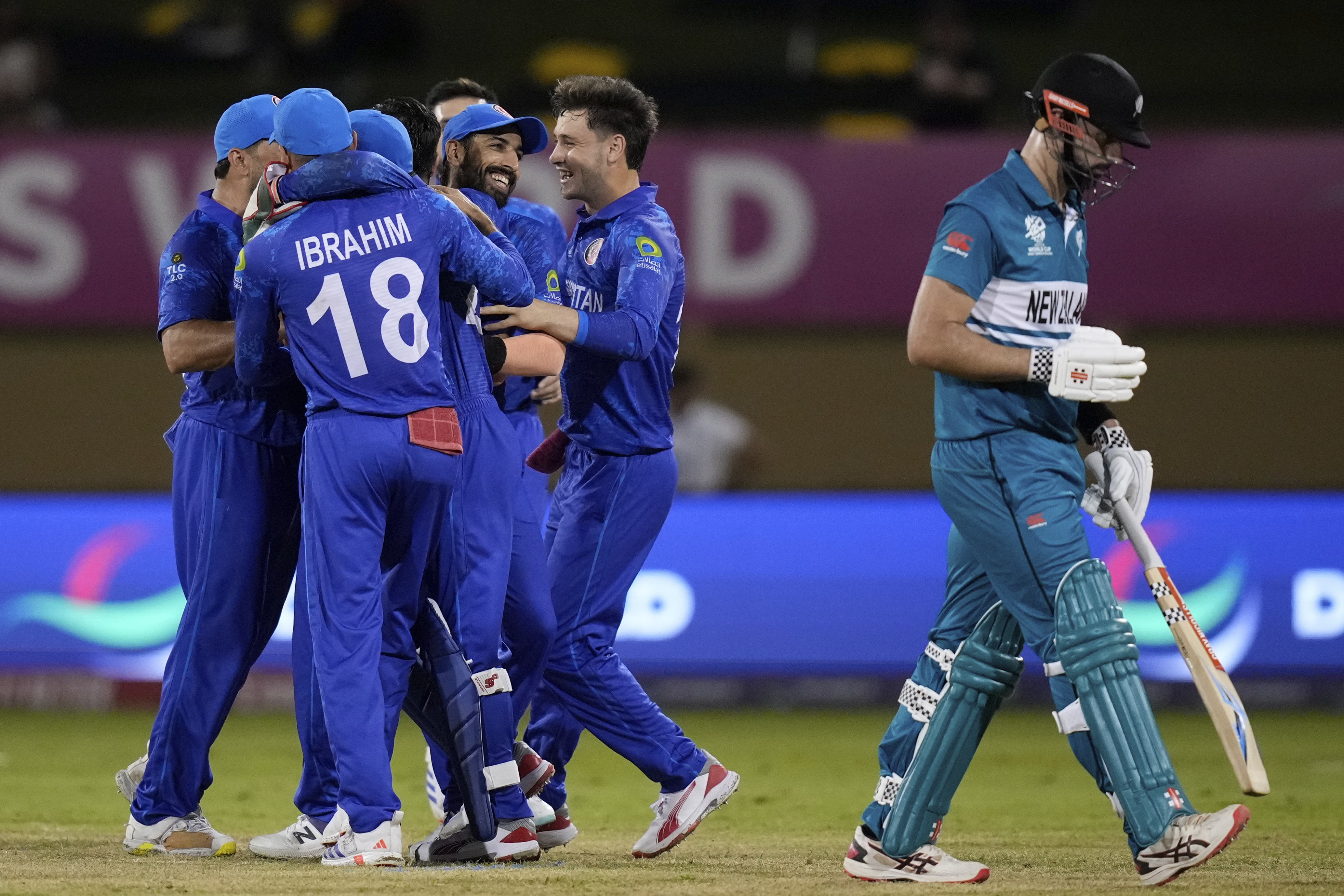 Afghanistan celebrate the dismissal of Daryl Mitchell. Photo / AP