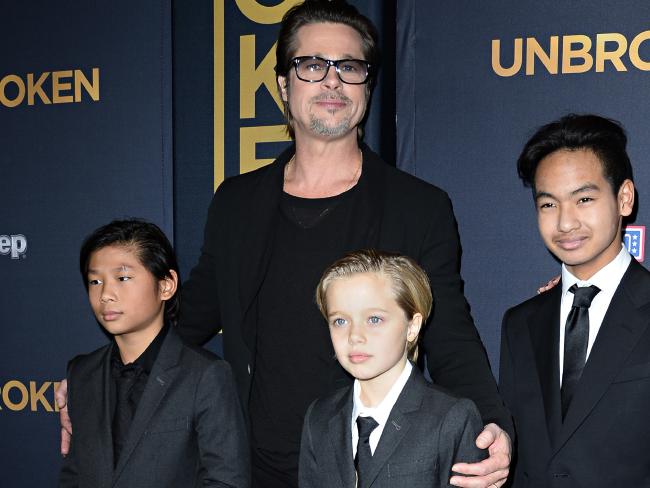 Brad Pitt and children Pax Jolie-Pitt (L), Shiloh Jolie-Pitt (C) and Maddox Jolie-Pitt in 2014. Photo / Getty Images