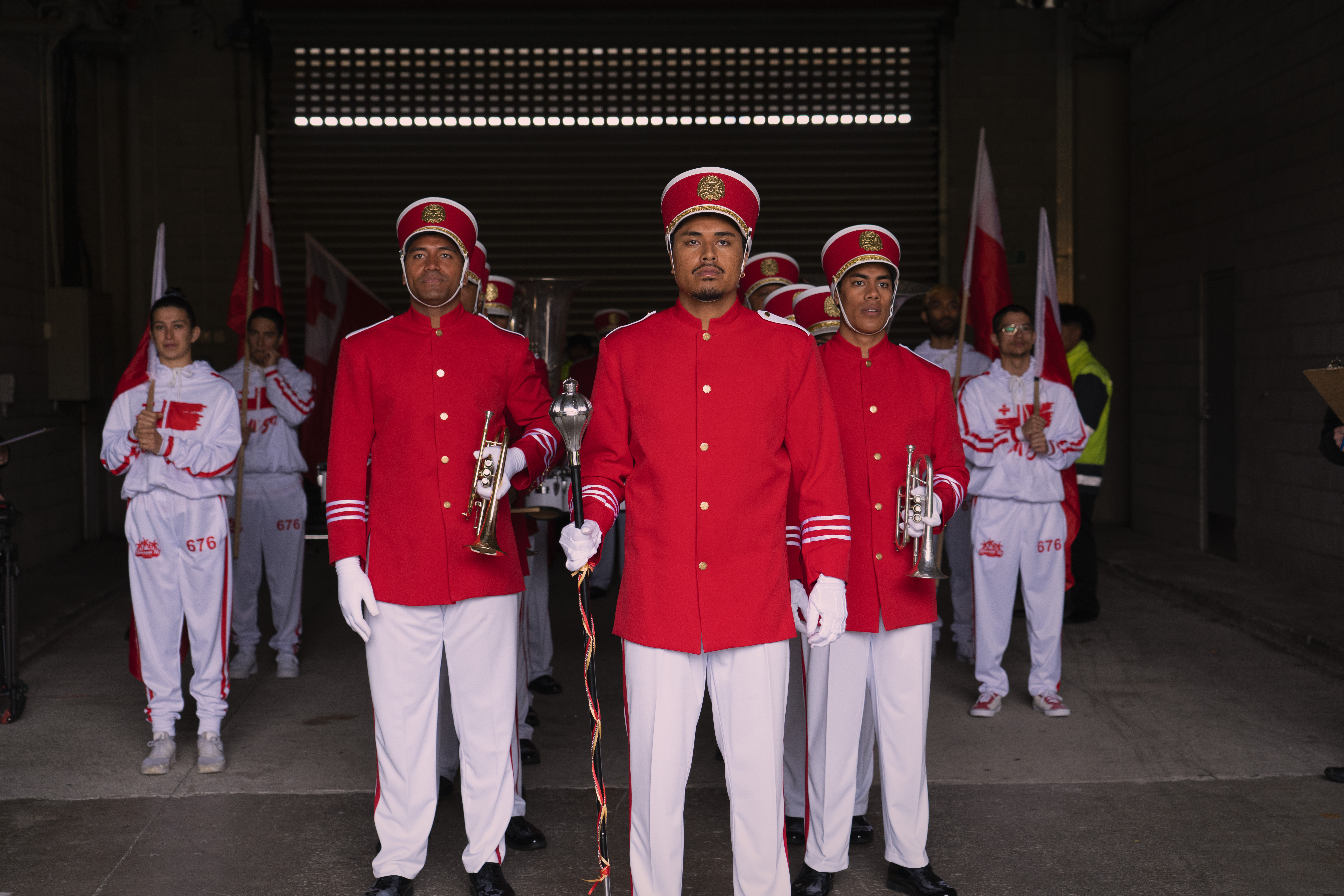 John-Paul Foliaki (centre) stars as main character and keen Tongan rugby fan Maka on the film Red, White & Brass.