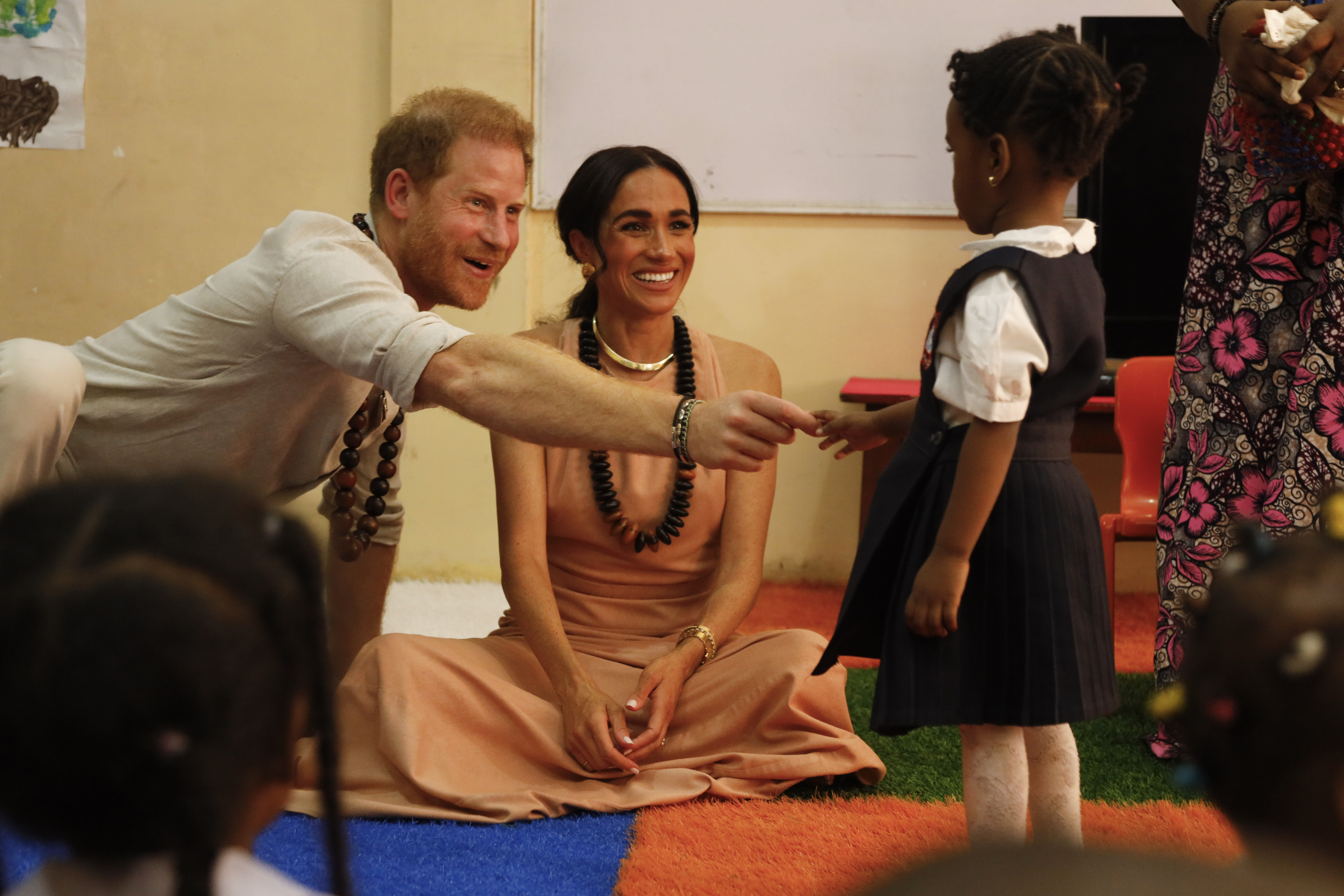 Prince Harry, Duke of Sussex, and Meghan, Duchess of Sussex, visit Lightway Academy in Abuja, Nigeria. Photo / Getty Images