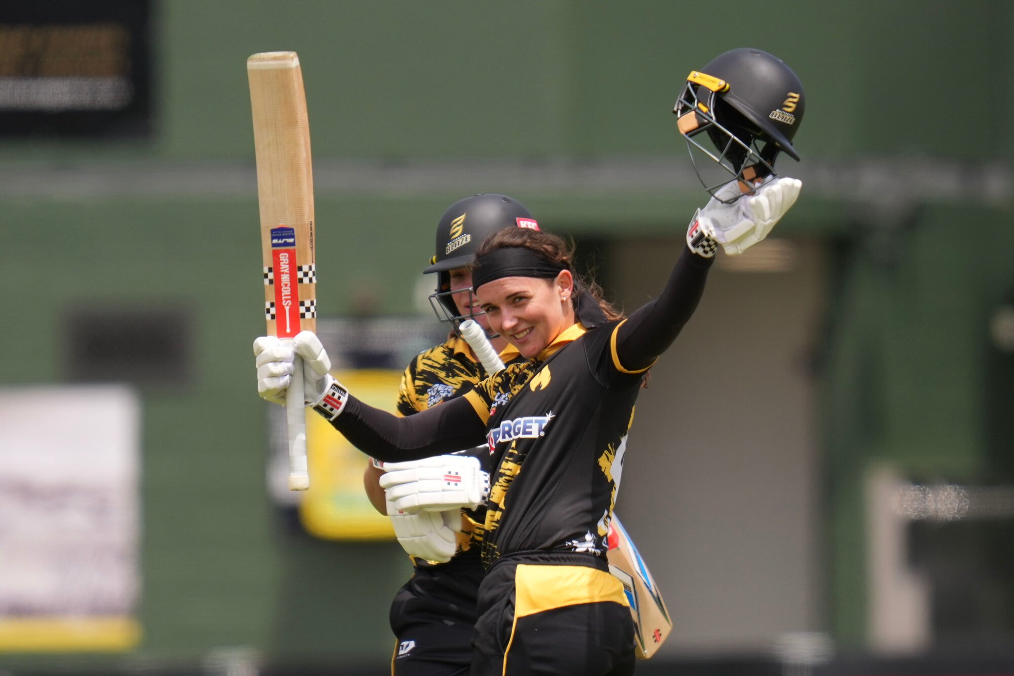 Wellington Blaze captain Melie Kerr celebrates 100 runs during the Super Smash at the Basin Reserve in December. Photo / Photosport