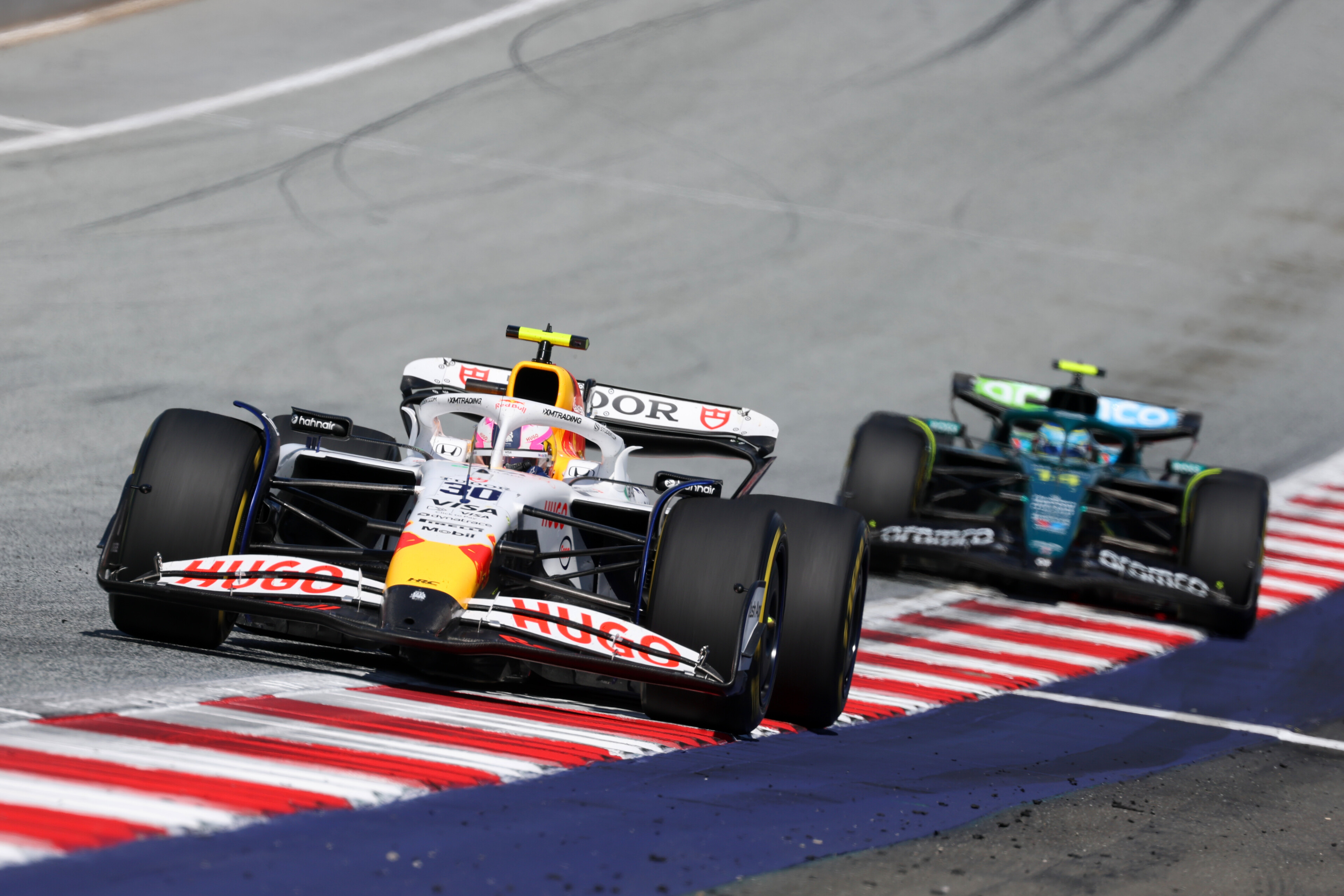 Liam Lawson leads Fernando Alonso, of Aston Martin, at the Austrian Grand Prix. Photo / Red Bull