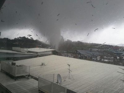 A tornado pictured tearing through Albany in 2011. Photo / Tim Wang