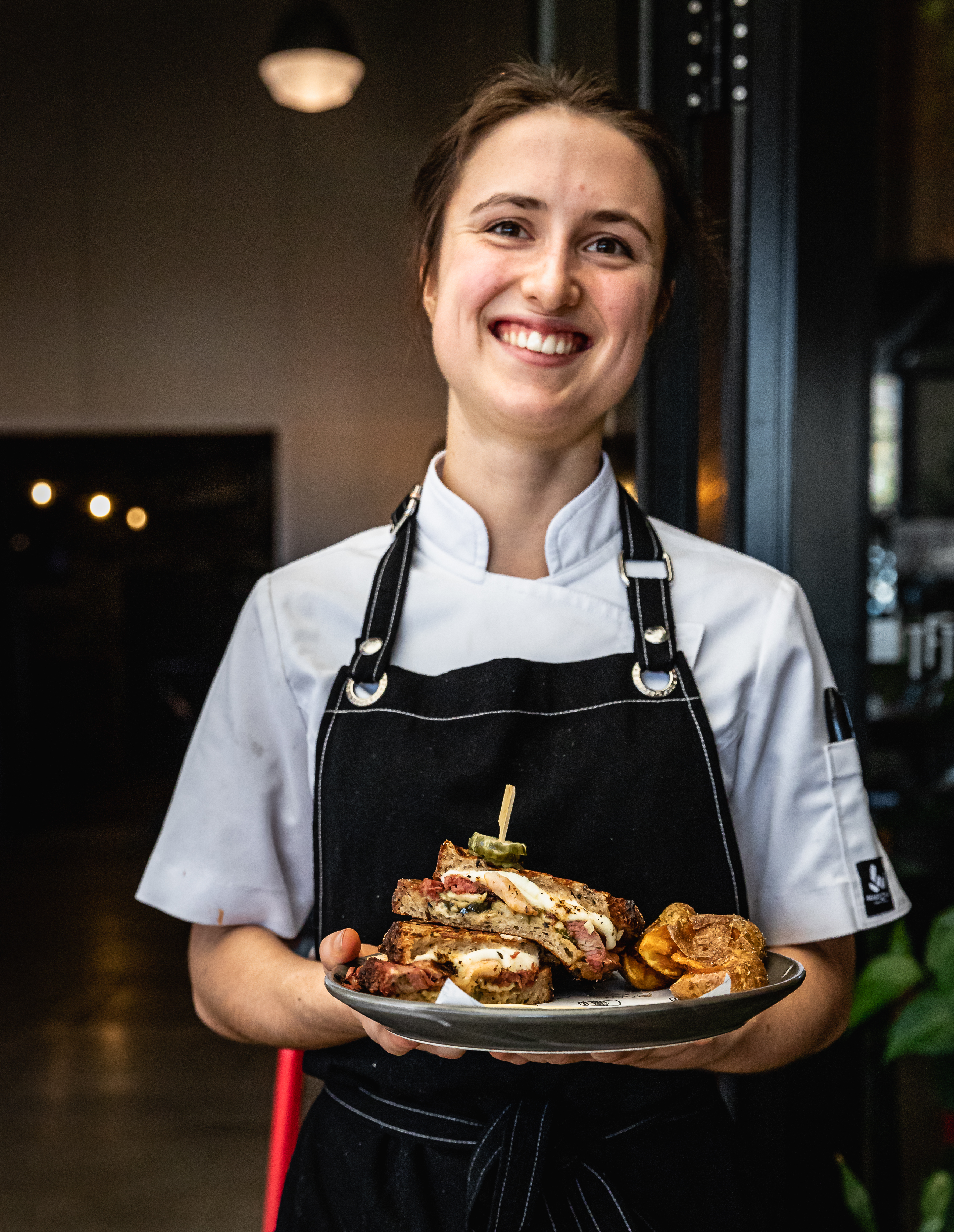 Brooke Moore and her winning toastie from Mt Maunganui’s Freeport with Cleaver & Co. Photo / Supplied