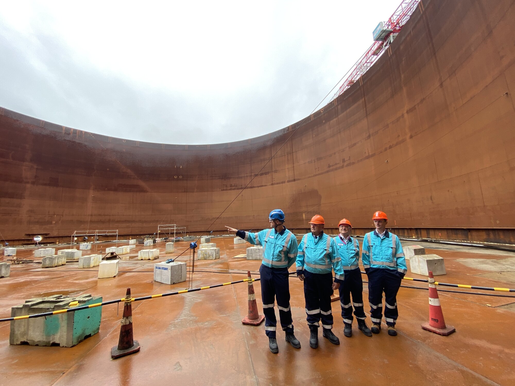 Channel Infrastructure chief executive Rob Buchanan, minister Shane Jones, Channel board chair James Miller and Z Energy chief executive Lindis Jones inspect the 30 million litre fuel tank, being repurposed to store aviation fuel. Photo / Denise Piper