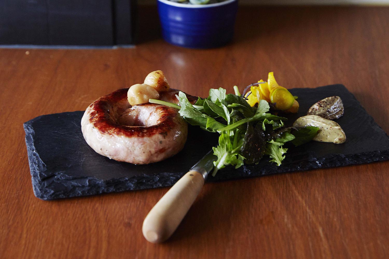 The quarter-metre pork sausage with pickles and mustard on the menu at Apero. Picture / Supplied