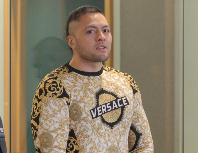 Comancheros vice president Tyson Daniels wearing Versace at his sentencing on money laundering. Photo / Michael Craig