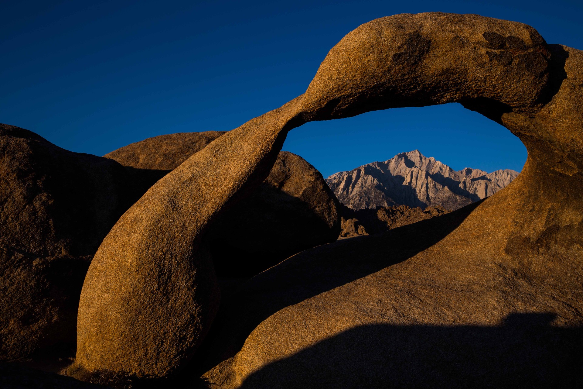 The Mobius Arch frames Lone Pine Peak in the Alabama Hills near Lone Pine, California. Photo / Max Whittaker, Visit California