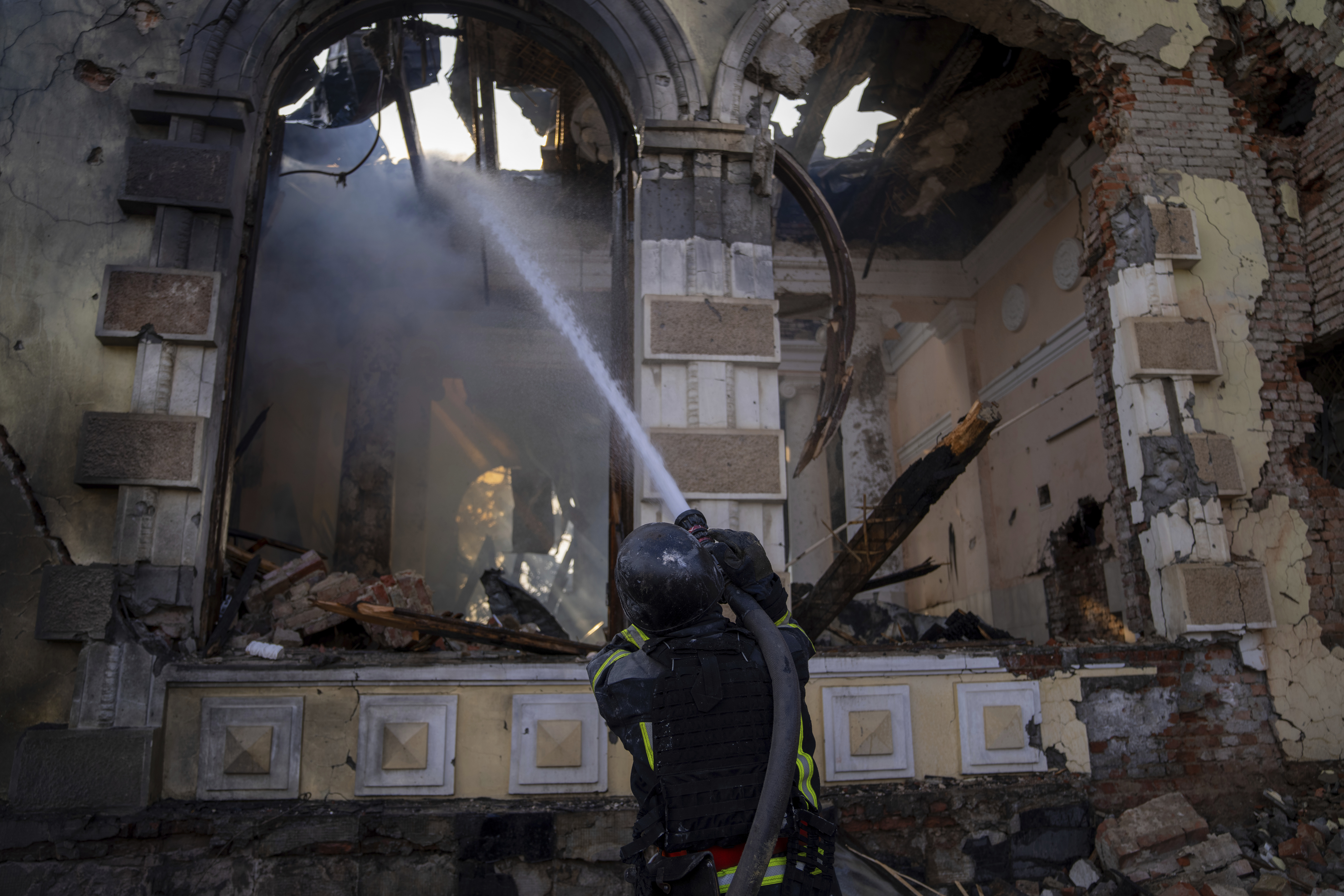 Firefighters put out the fire at a railway station after a Russian strike in Kostiantynivka in the Donetsk region, Ukraine on Sunday, February 25, 2024. A woman was wounded and a railway station, shops and residential houses were badly damaged amid heavy bombing. Photo / AP
