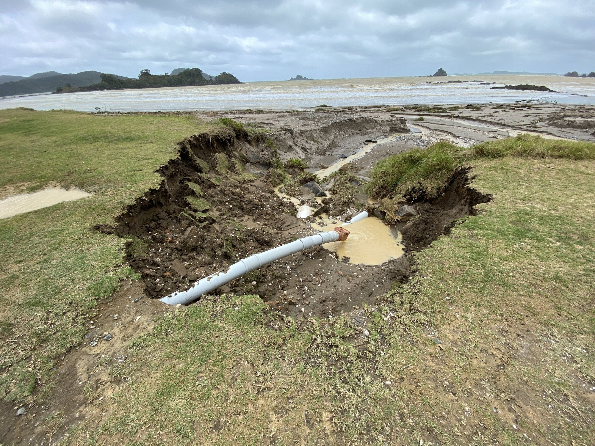 The Ōakura beachfront has been badly eroded by Sunday’s deluge, with fears over more wind and rain to come. Photo / Denise Piper