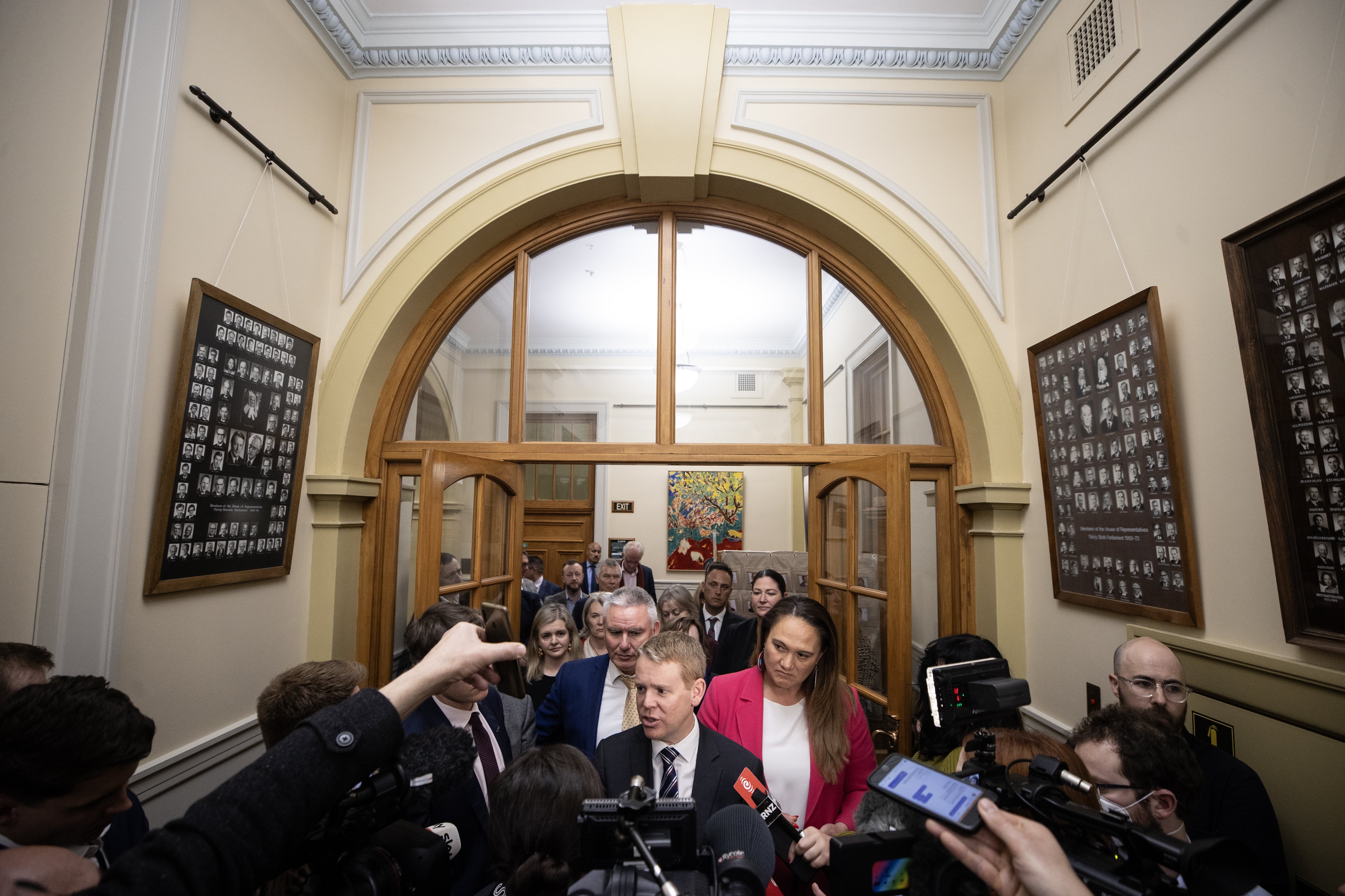 Chris Hipkins faces the news media on his way to a caucus meeting at Parliament after the election. Photo / George Heard