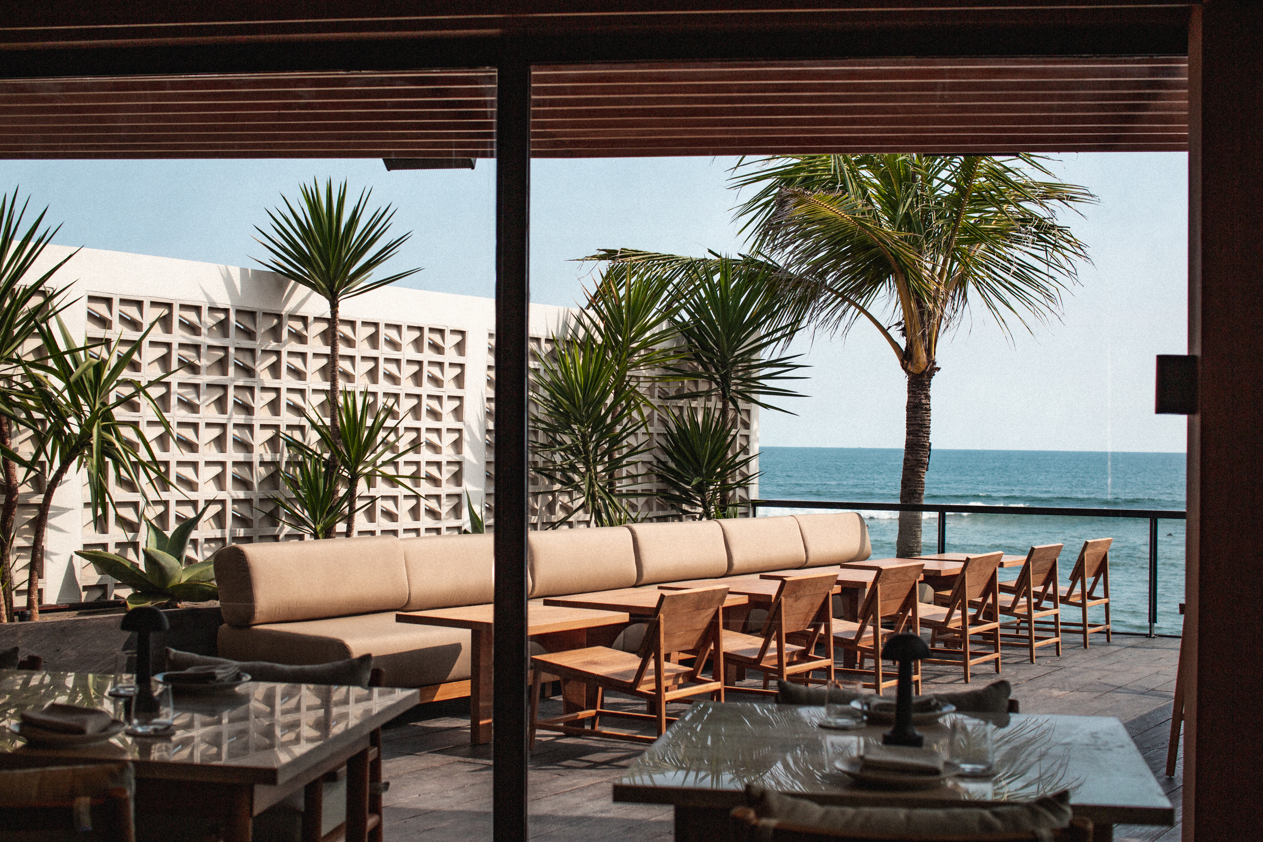 Dine on the waterfront at Skool, an open-flame restaurant located along Batu Bolong Beach. Photo / Supplied
