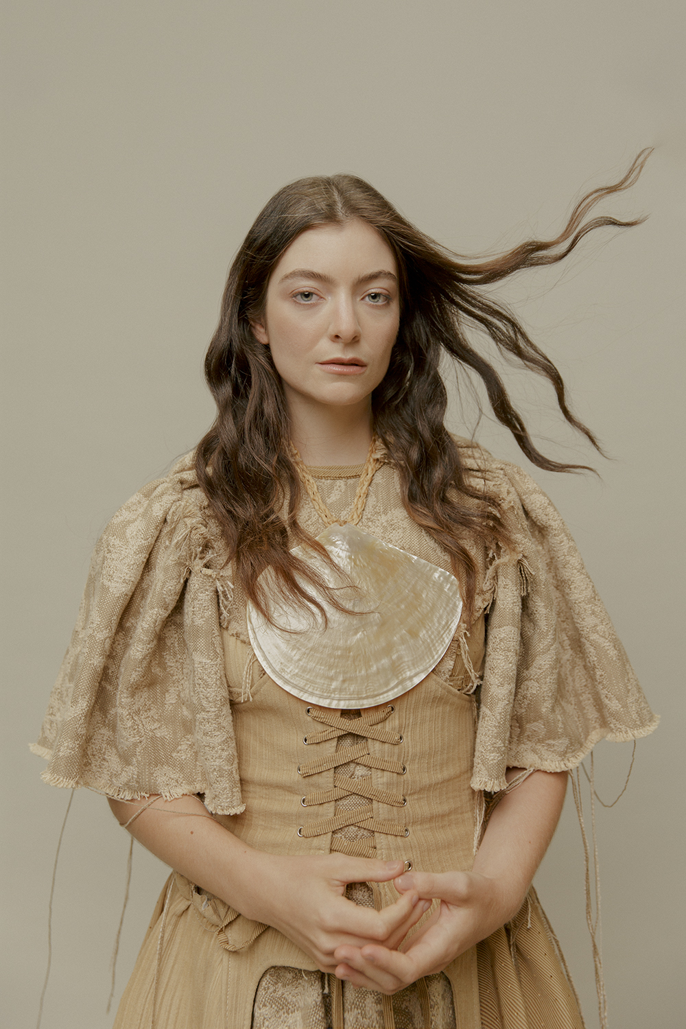 A dystopian future might be sober inspiration but it’s an unavoidable reality that offers plenty of opportunity to explore alternate realities. Whitecliffe College of Arts and Design graduate Tom Munday combines subversive humour and faded glamour, an intoxicating proposition with a focus on zero-waste design methods. Tom Munday dress (POA). Rarotongan mother of pearl necklace, stylist’s own. Photographer / Hohua Ropate Kurene