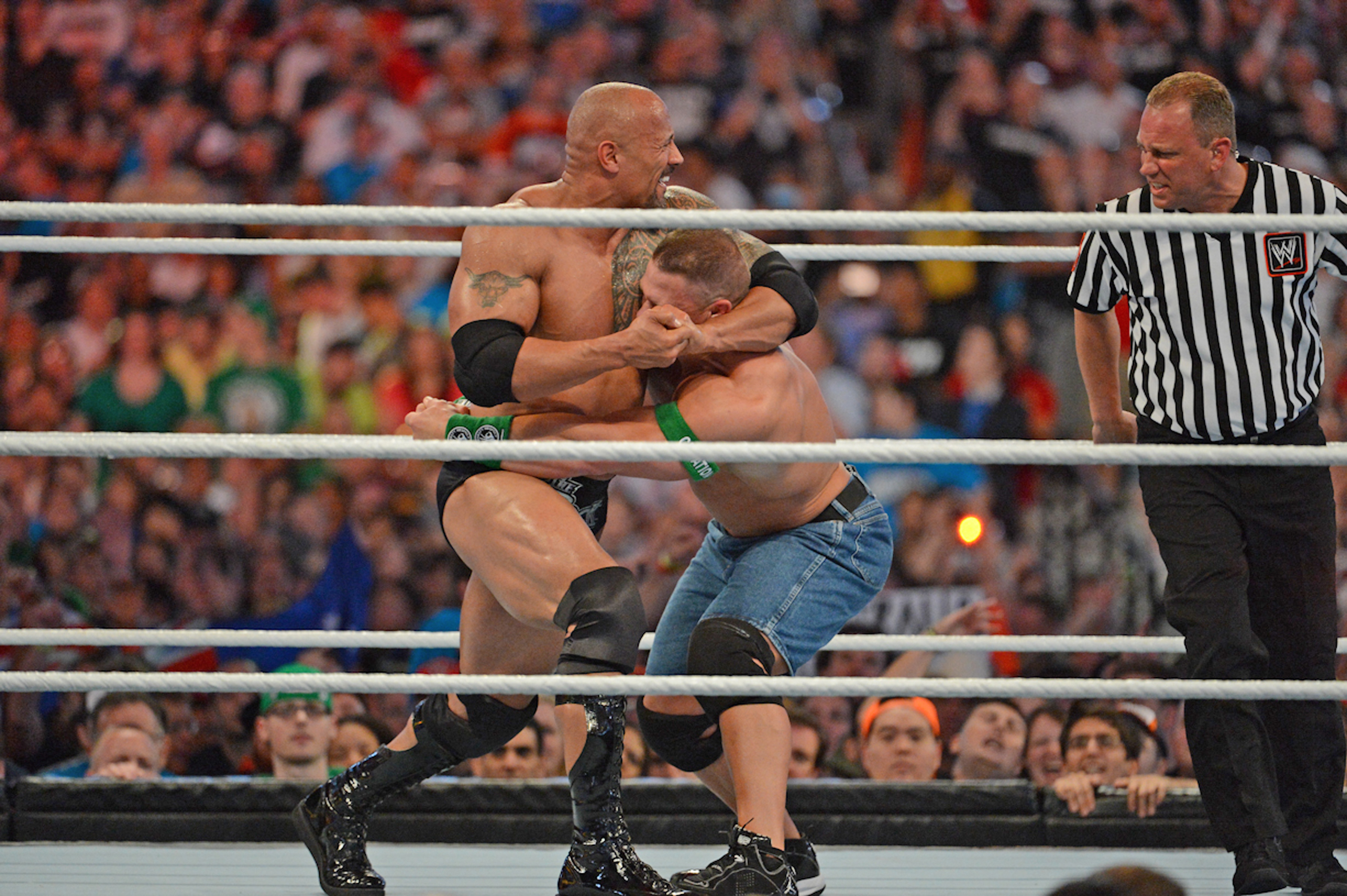 Dwayne 'The Rock' Johnson and John Cena in action during WrestleMania XXVIII. Photo / Getty Images