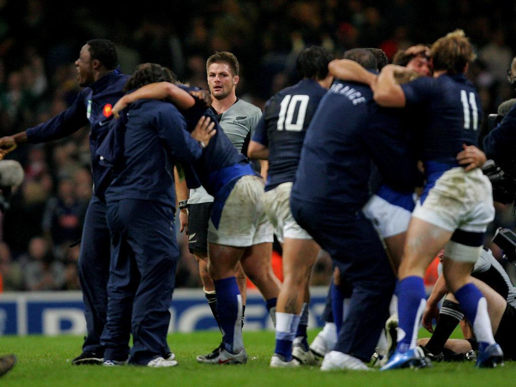 All Blacks captain Richie McCaw looks on in disbelief as the French players celebrate after their famous Cardiff win in 2007. Photo / Brett Phibbs