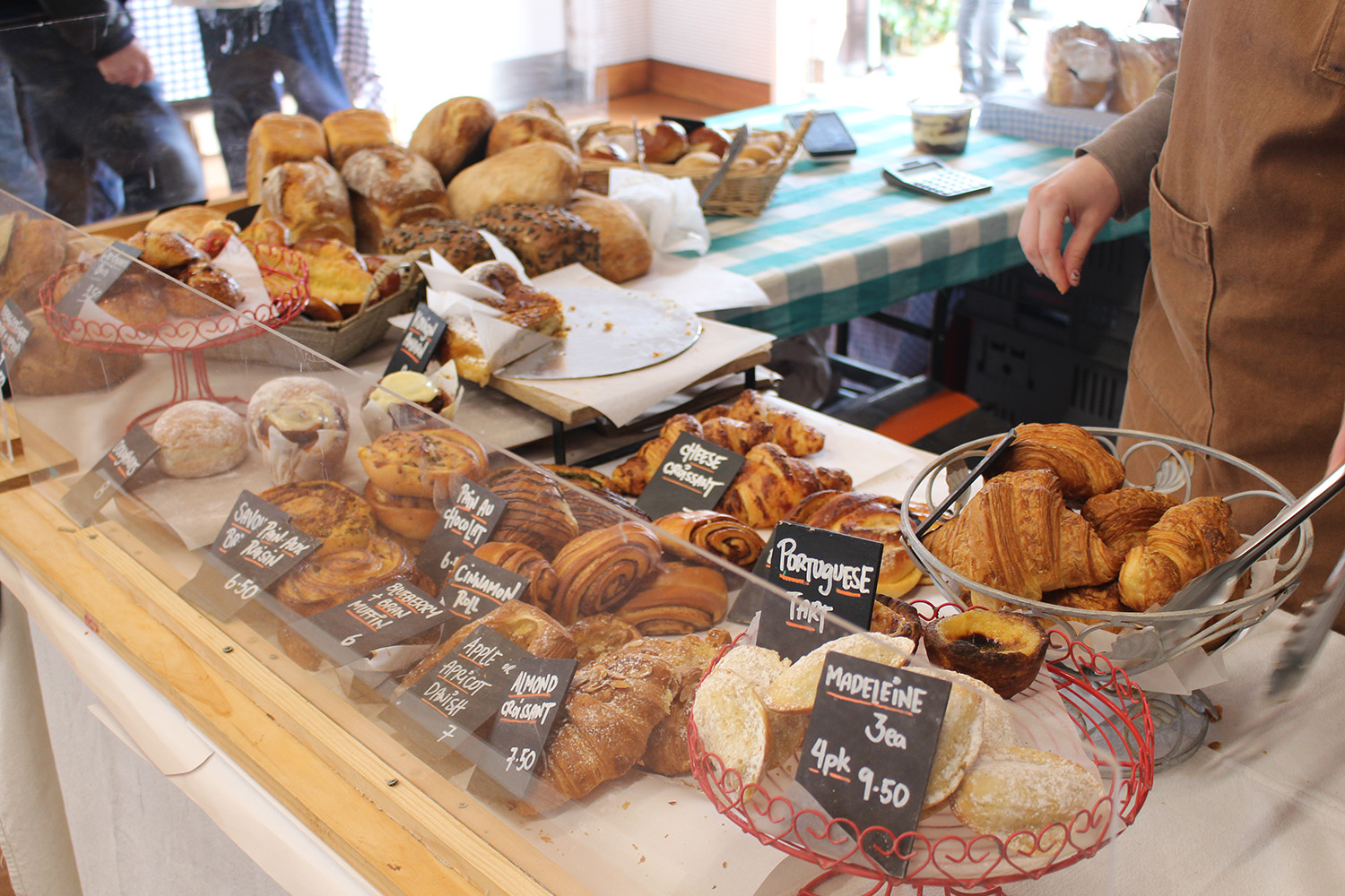 The Bread & Butter stall inside Grey Lynn’s community hall at the weekly farmers market. Photo / Madeleine Crutchley