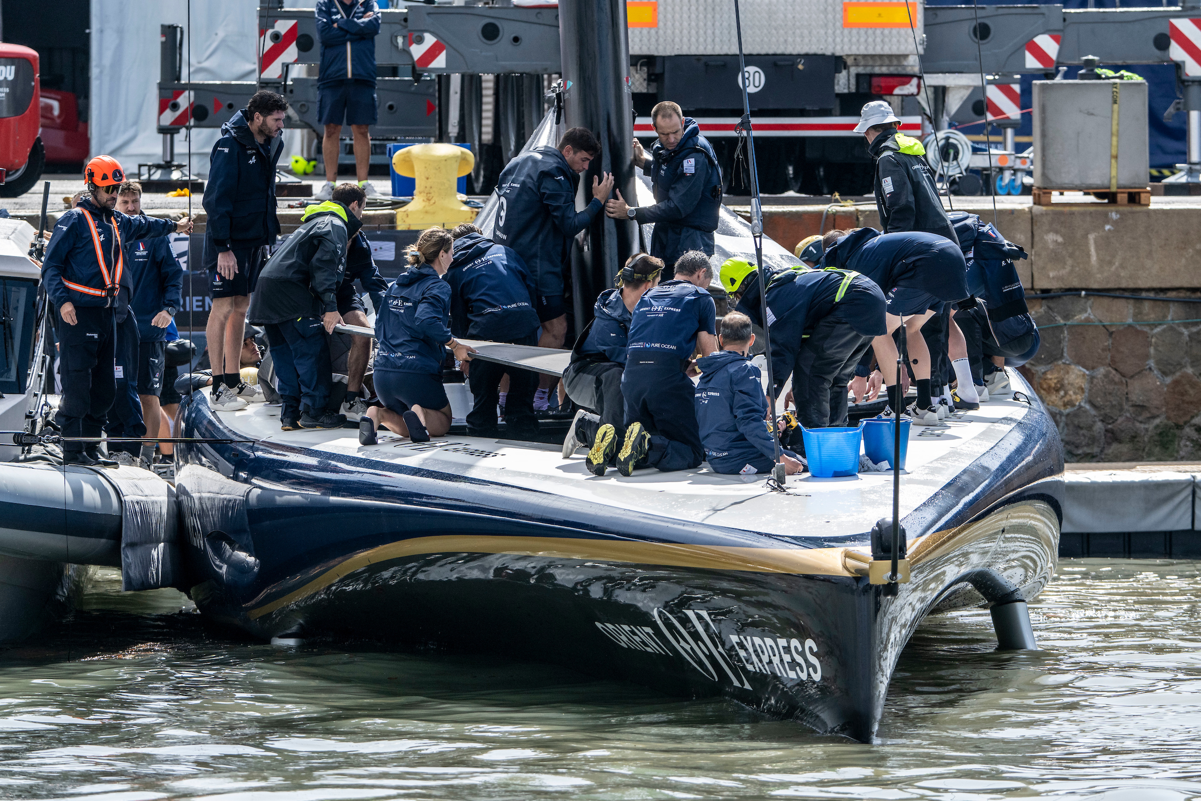 Orient Express Racing Team were racing the clock to get the boat back on the water after it was damaged. Photo / Ricardo Pinto, America's Cup