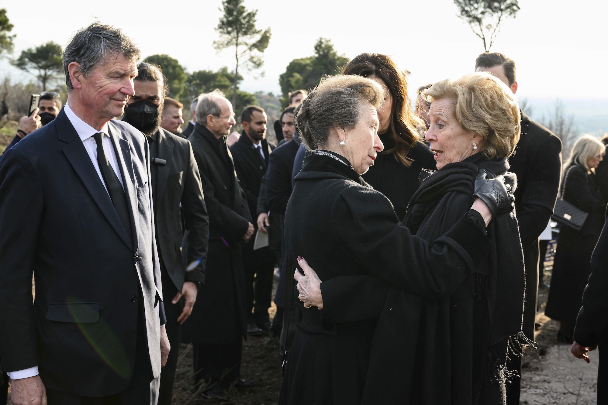 Princess Anne, left, hugs Anne-Marie, wife of former king of Greece Constantine II during the funeral. Photo / AP