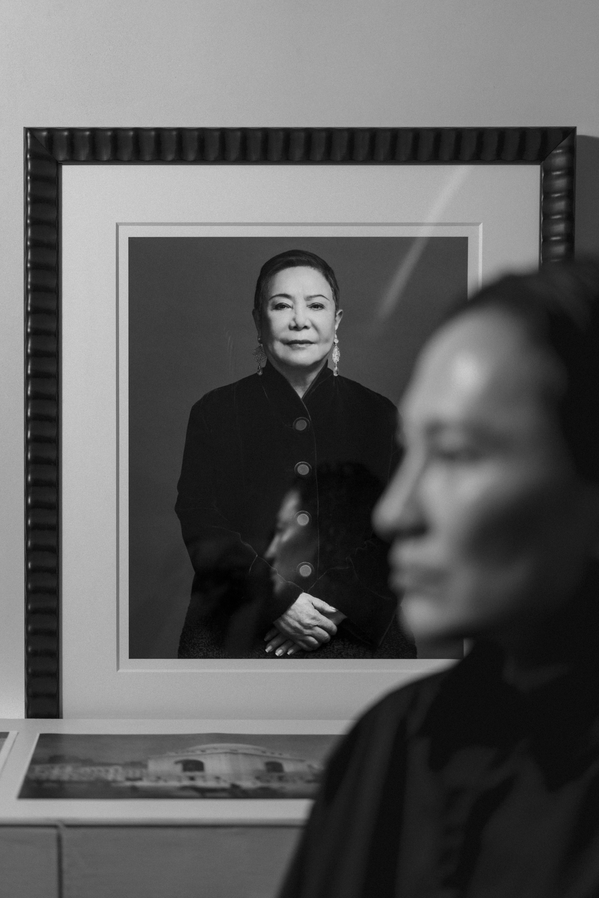 Wang said the collection revealed last Friday is dedicated to his 83-year-old mother. She is pictured in the portrait behind him, which hangs prominently in his office. Photo / Oliver Farshi, The Washington Post